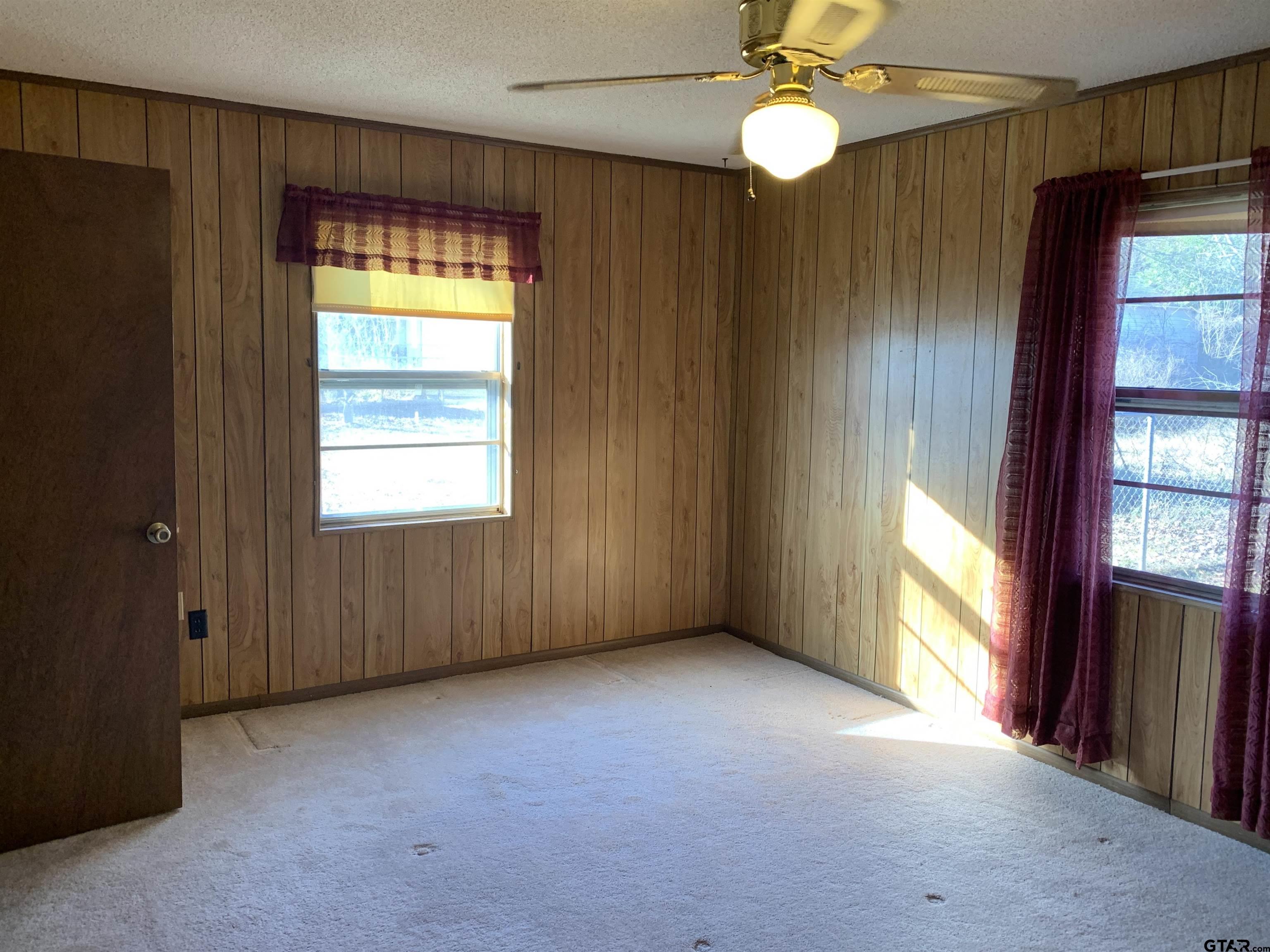 304 6th Street Southwest Bogata, TX 75417 - Photo 20 of 30 a view of an empty room with window and chandelier fan