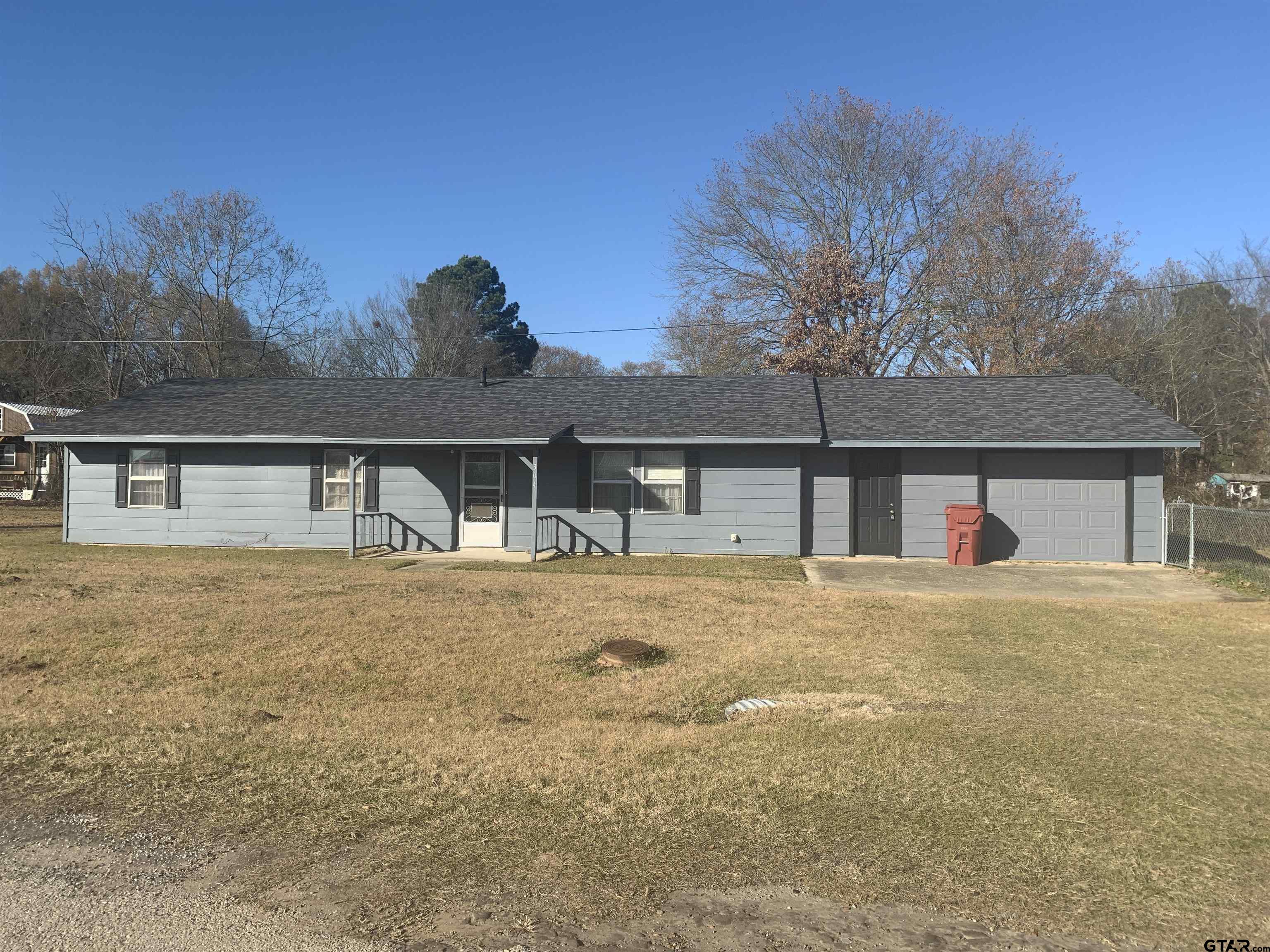 304 6th Street Southwest Bogata, TX 75417 - Photo 2 of 30 a front view of house with yard