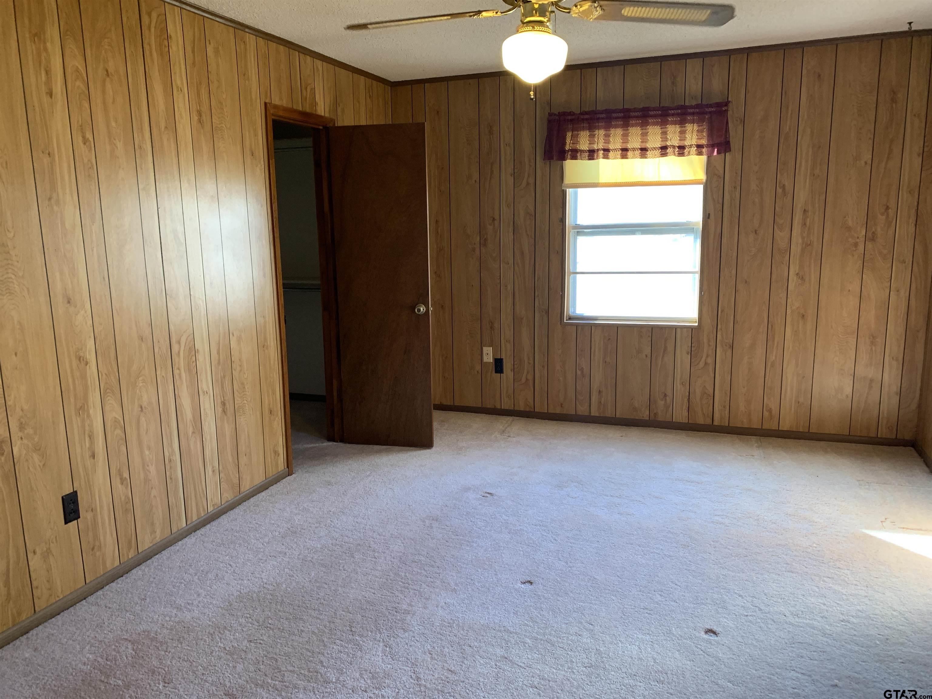 304 6th Street Southwest Bogata, TX 75417 - Photo 22 of 30 an empty room with windows