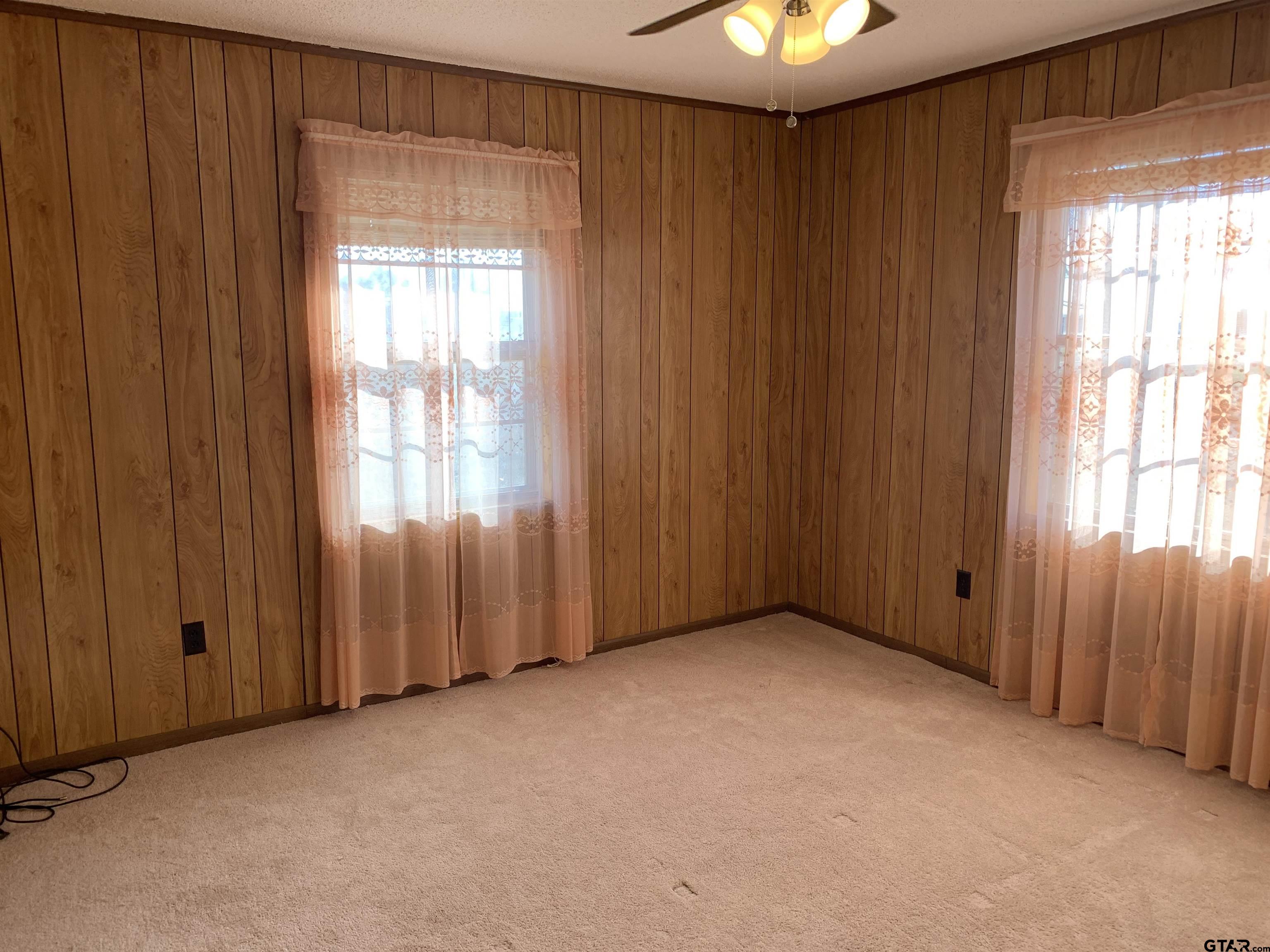304 6th Street Southwest Bogata, TX 75417 - Photo 23 of 30 an empty room with windows and closet