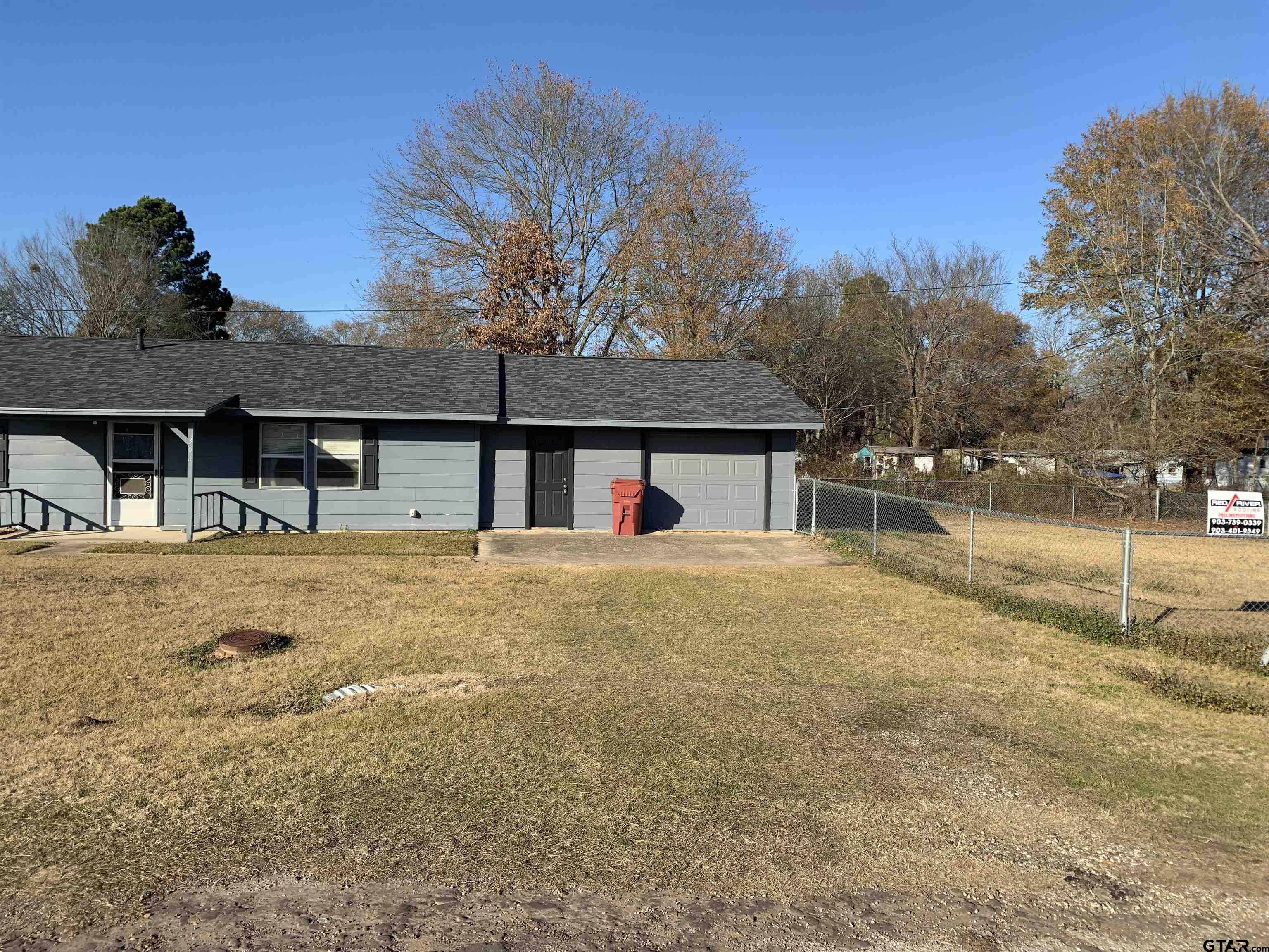 304 6th Street Southwest Bogata, TX 75417 - Photo 29 of 30 a couple of cars parked in front of house