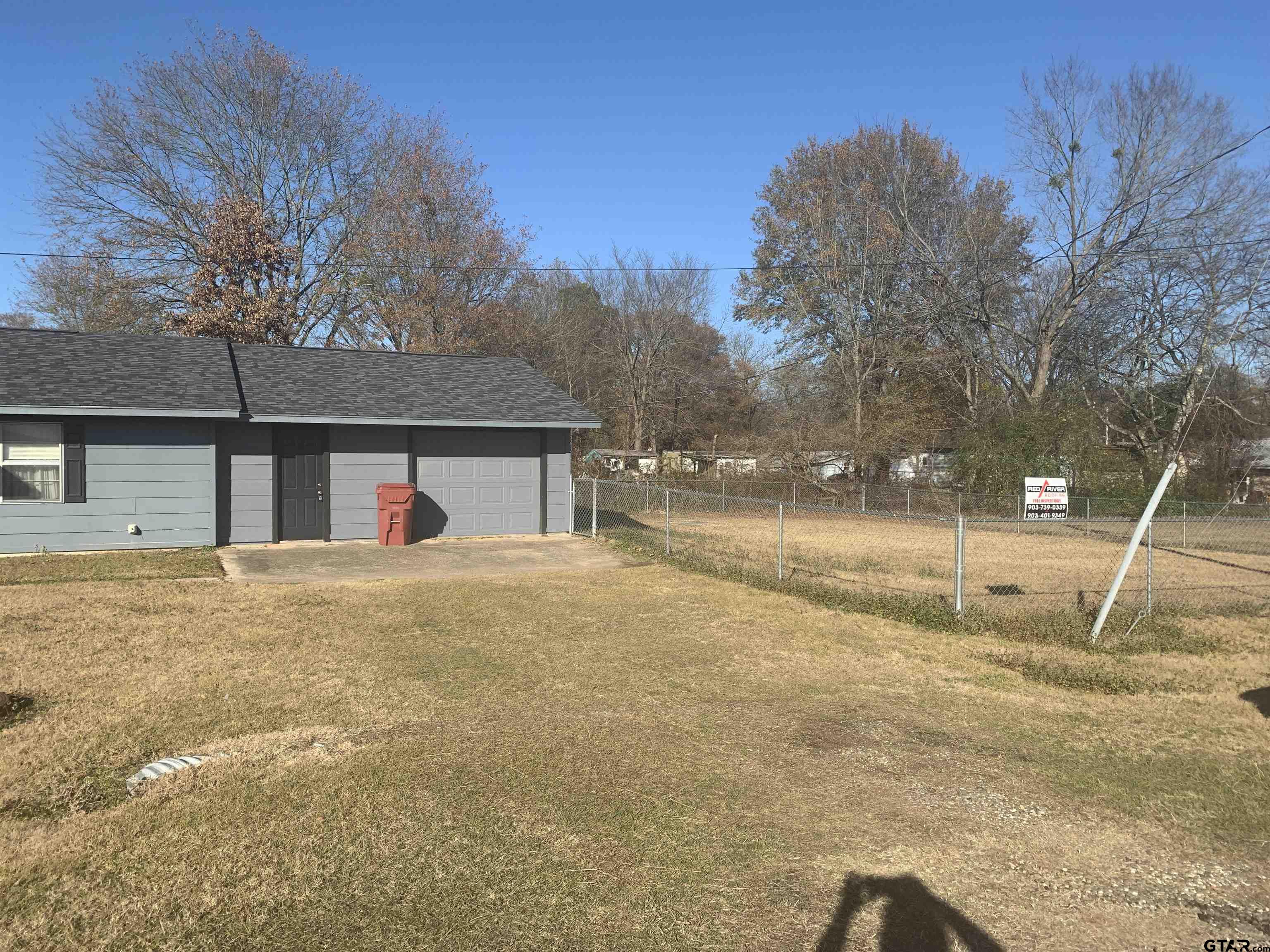 304 6th Street Southwest Bogata, TX 75417 - Photo 3 of 30 a view of a house with a yard and garage