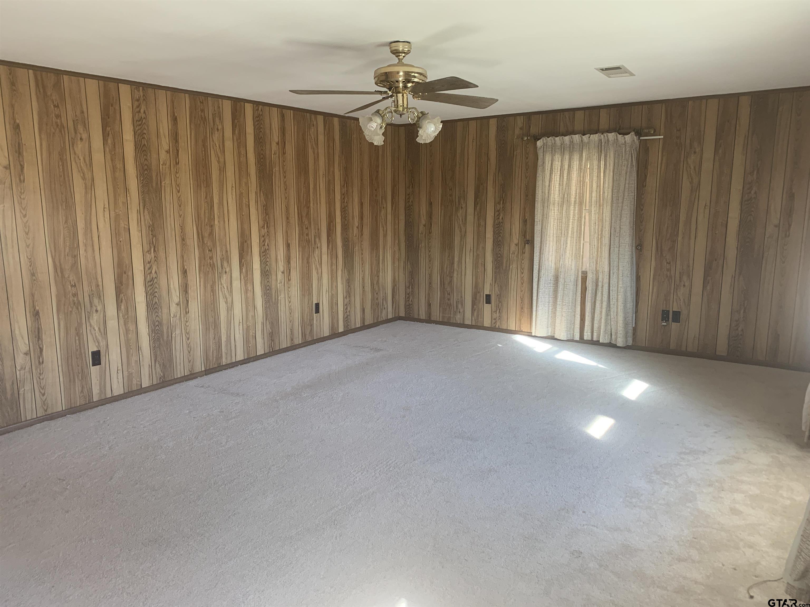 304 6th Street Southwest Bogata, TX 75417 - Photo 6 of 30 a view of a livingroom with a ceiling fan and window