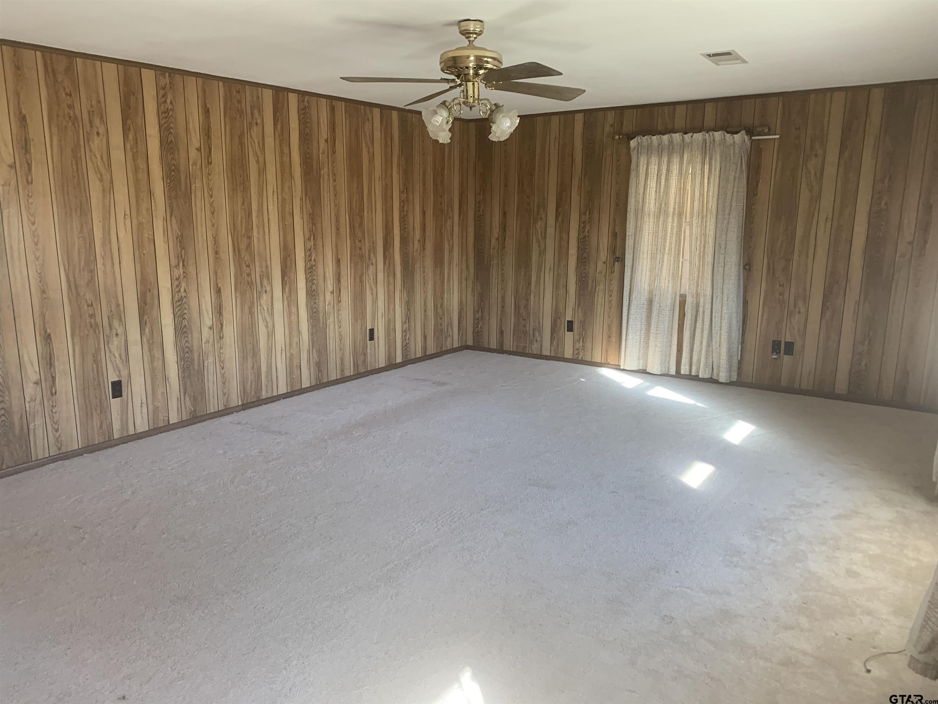 304 6th Street Southwest Bogata, TX 75417 - Photo 7 of 30 a view of a livingroom with a ceiling fan and window