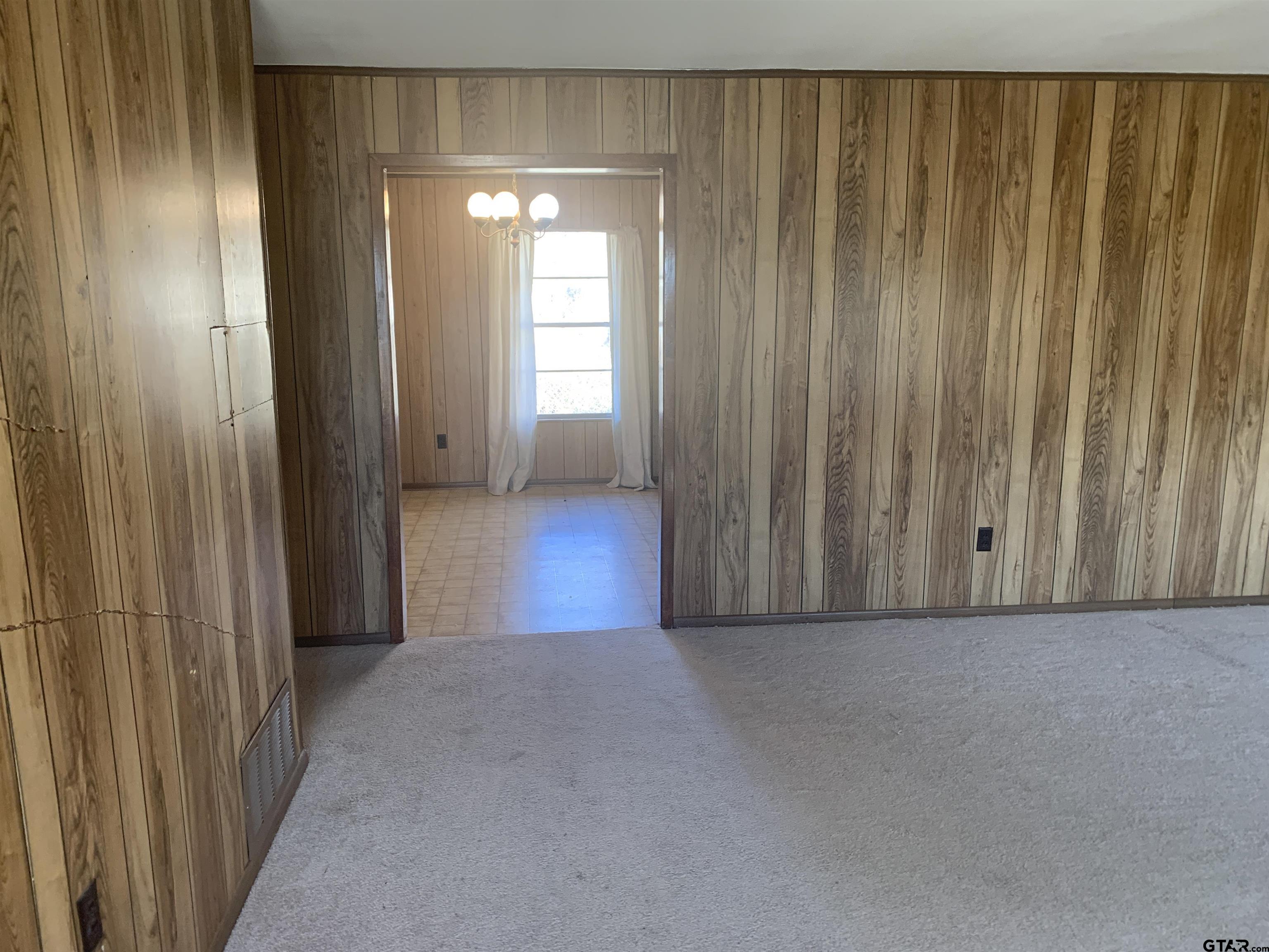304 6th Street Southwest Bogata, TX 75417 - Photo 9 of 30 a view of a livingroom with a wooden door