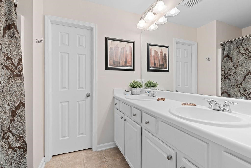 7033 Racine Way Raleigh, NC 27615 - Photo 20 of 30 Owner's Bath with Dual Vanity Sinks and Private Commode