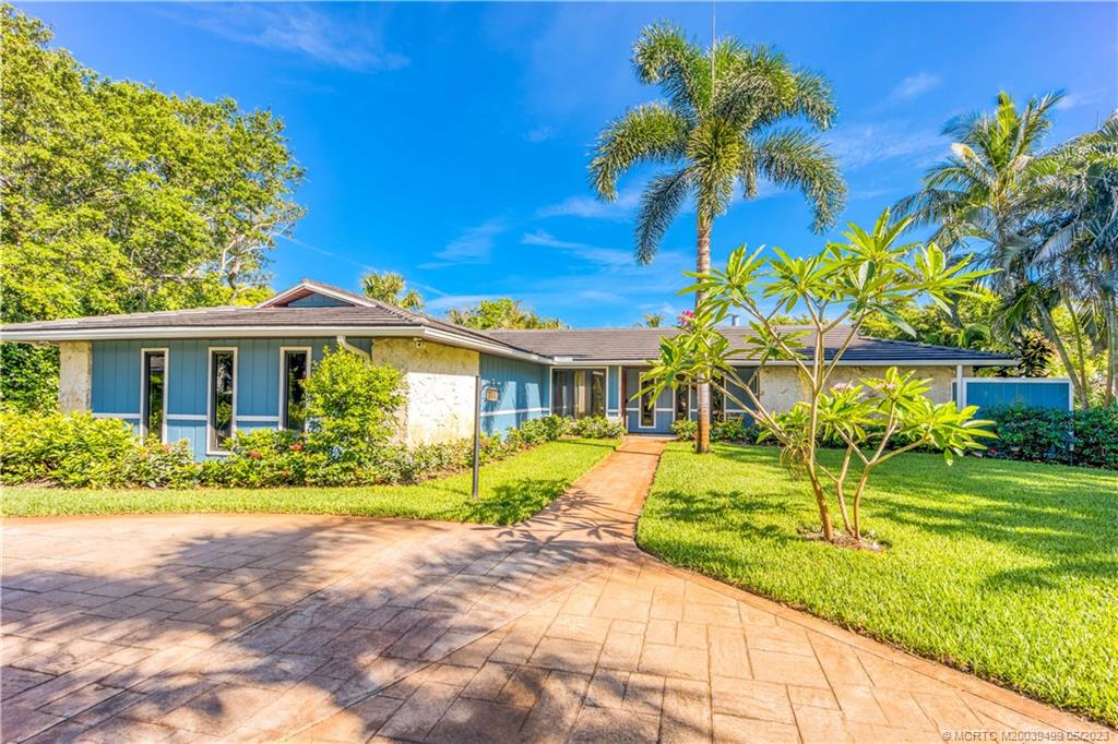 4 Ridgeview Road North Stuart, FL 34996 - Photo 11 of 57 a front view of house with yard and green space
