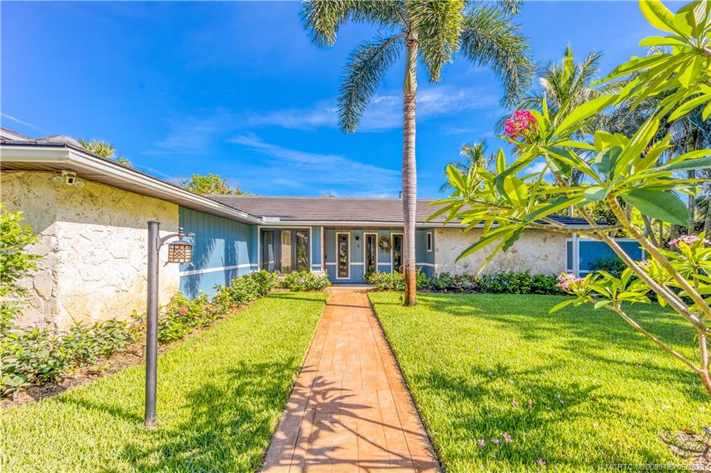 4 Ridgeview Road North Stuart, FL 34996 - Photo 12 of 57 a view of a house with a swimming pool