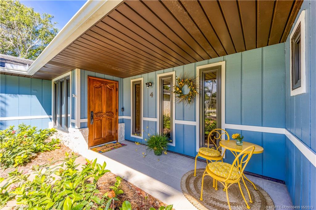 4 Ridgeview Road North Stuart, FL 34996 - Photo 13 of 57 a front view of house with patio