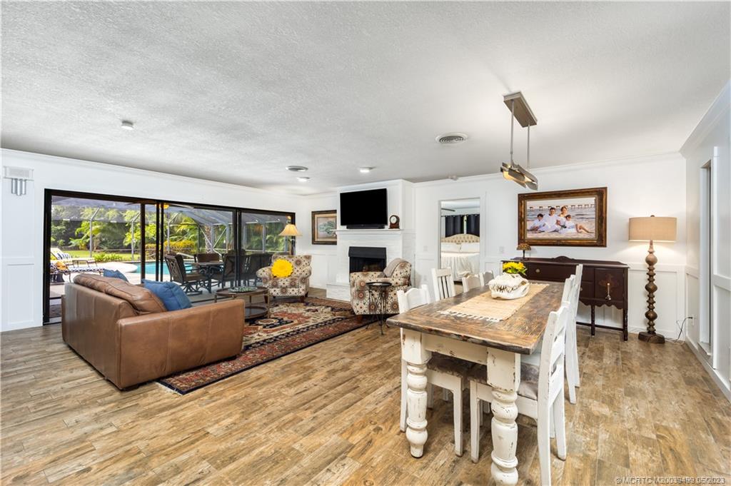 4 Ridgeview Road North Stuart, FL 34996 - Photo 15 of 57 a living room with fireplace furniture and a large window