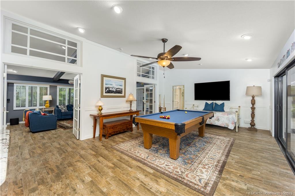 4 Ridgeview Road North Stuart, FL 34996 - Photo 25 of 57 a living room with furniture and a flat screen tv