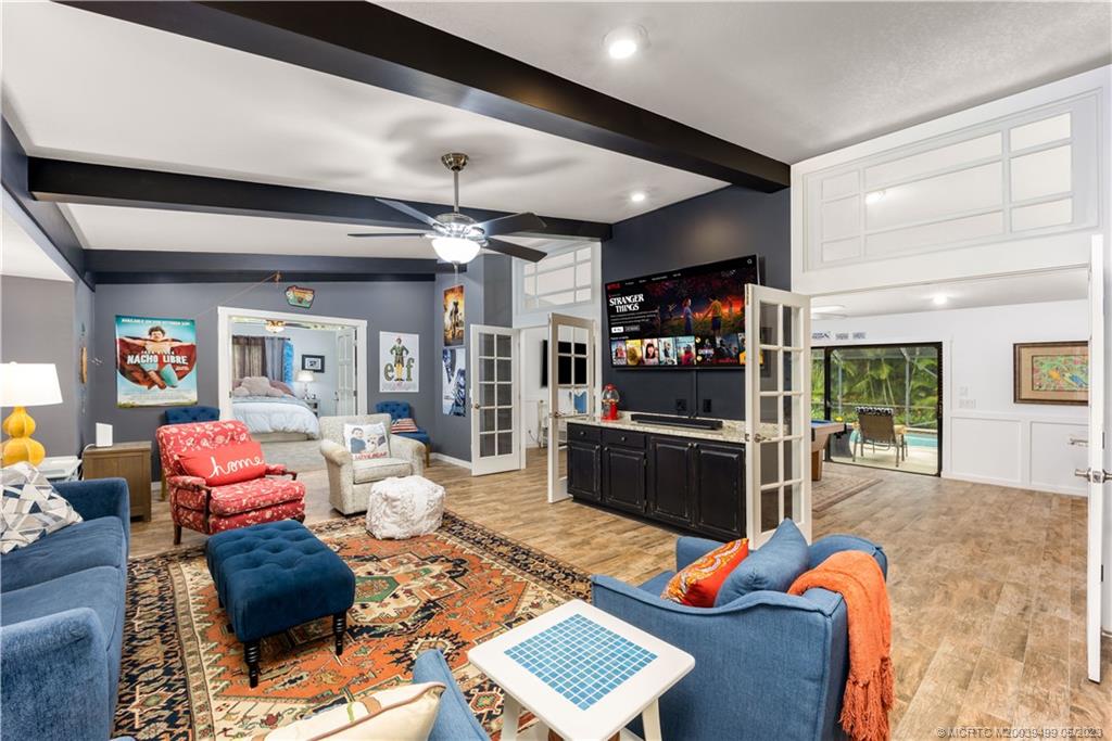 4 Ridgeview Road North Stuart, FL 34996 - Photo 27 of 57 a living room with furniture a rug and a window