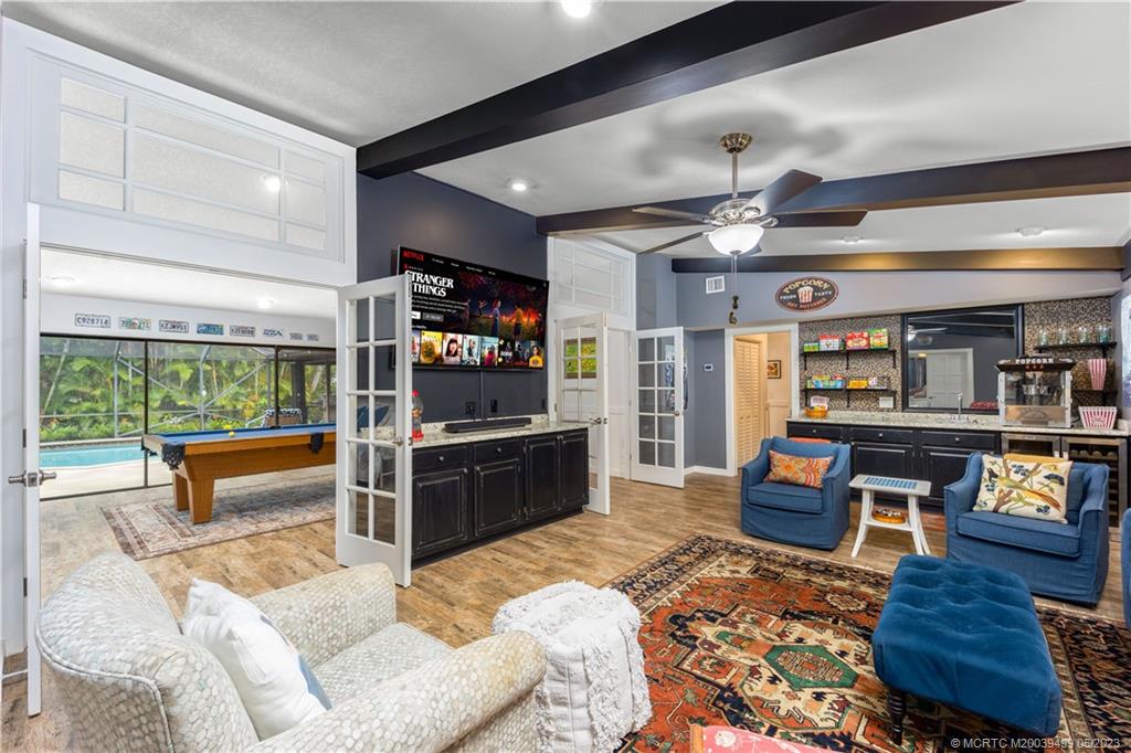4 Ridgeview Road North Stuart, FL 34996 - Photo 28 of 57 a living room with furniture and a flat screen tv
