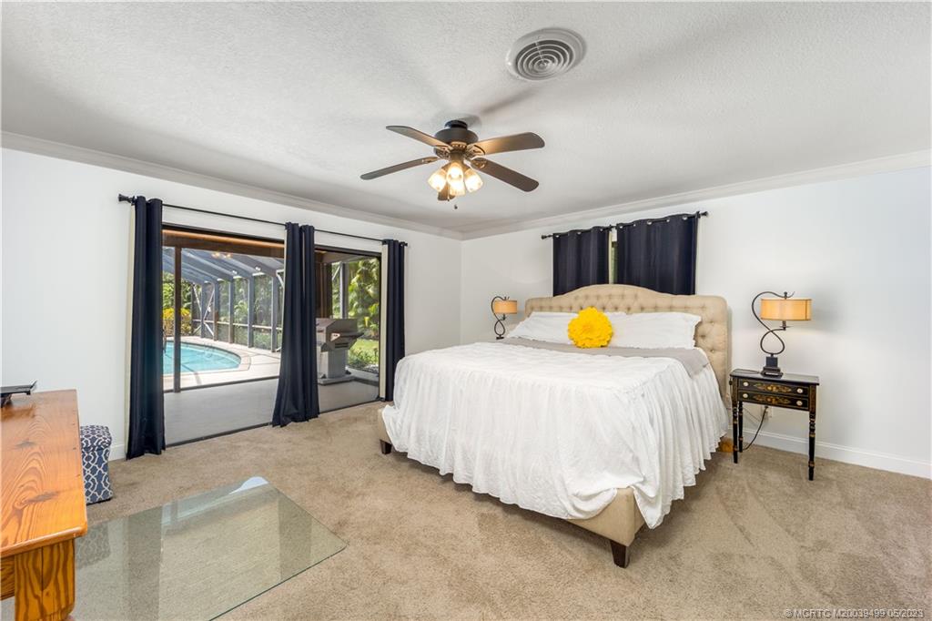 4 Ridgeview Road North Stuart, FL 34996 - Photo 30 of 57 a bedroom with a bed and window