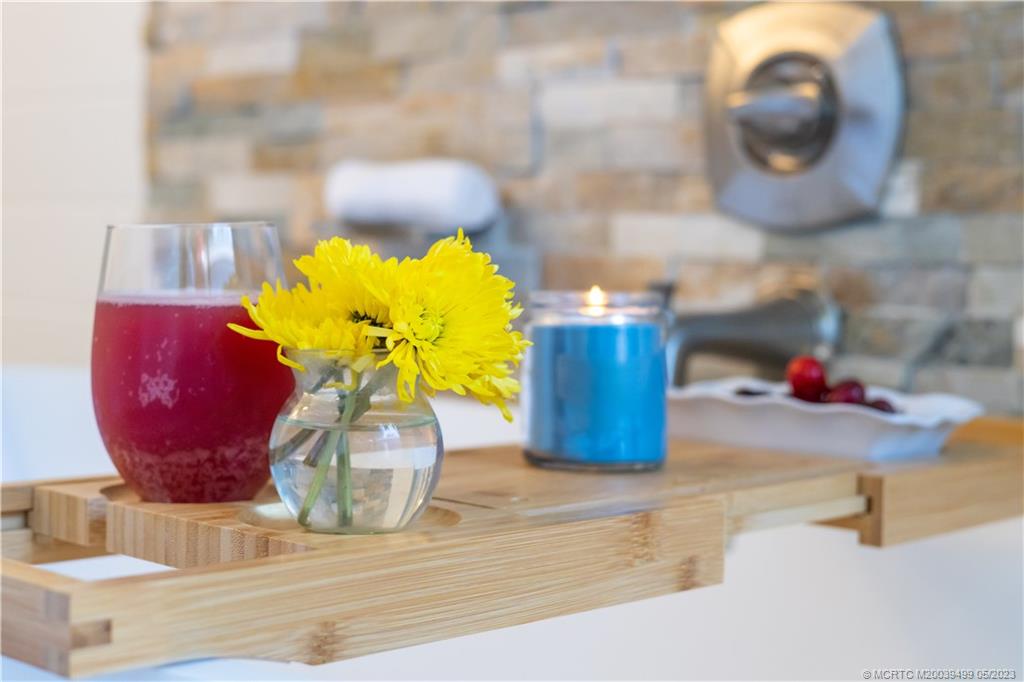 4 Ridgeview Road North Stuart, FL 34996 - Photo 36 of 57 a glass vase with flowers on a table