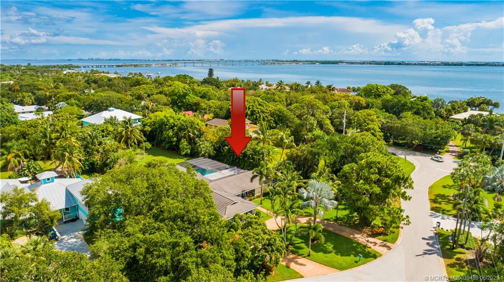 4 Ridgeview Road North Stuart, FL 34996 - Photo 4 of 57 a view of a lake with a building in the background
