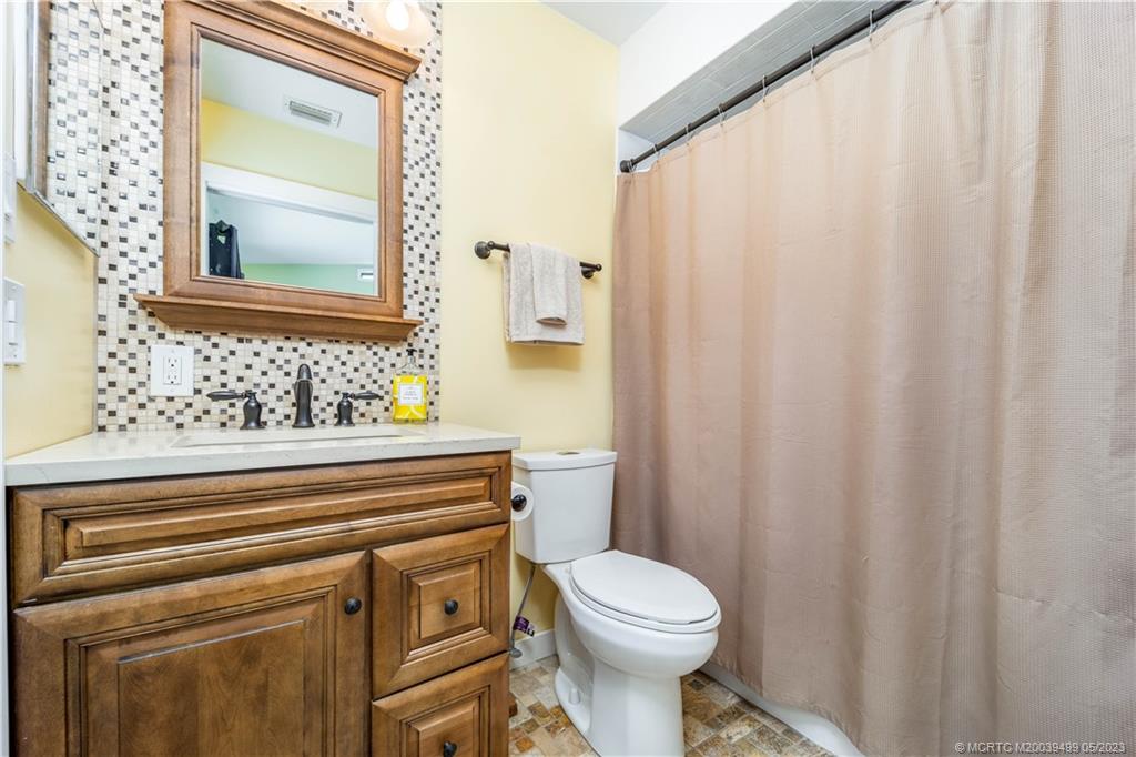 4 Ridgeview Road North Stuart, FL 34996 - Photo 41 of 57 a bathroom with a sink a toilet and a mirror