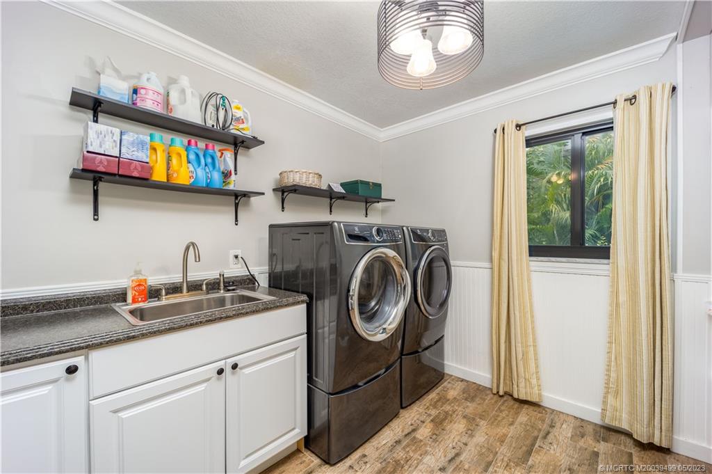 4 Ridgeview Road North Stuart, FL 34996 - Photo 42 of 57 a utility room with sink dryer and washer