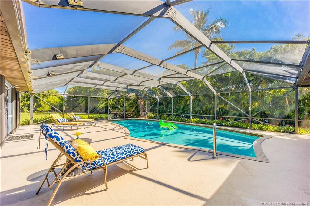 4 Ridgeview Road North Stuart, FL 34996 - Photo 45 of 57 a view of a backyard with swimming pool