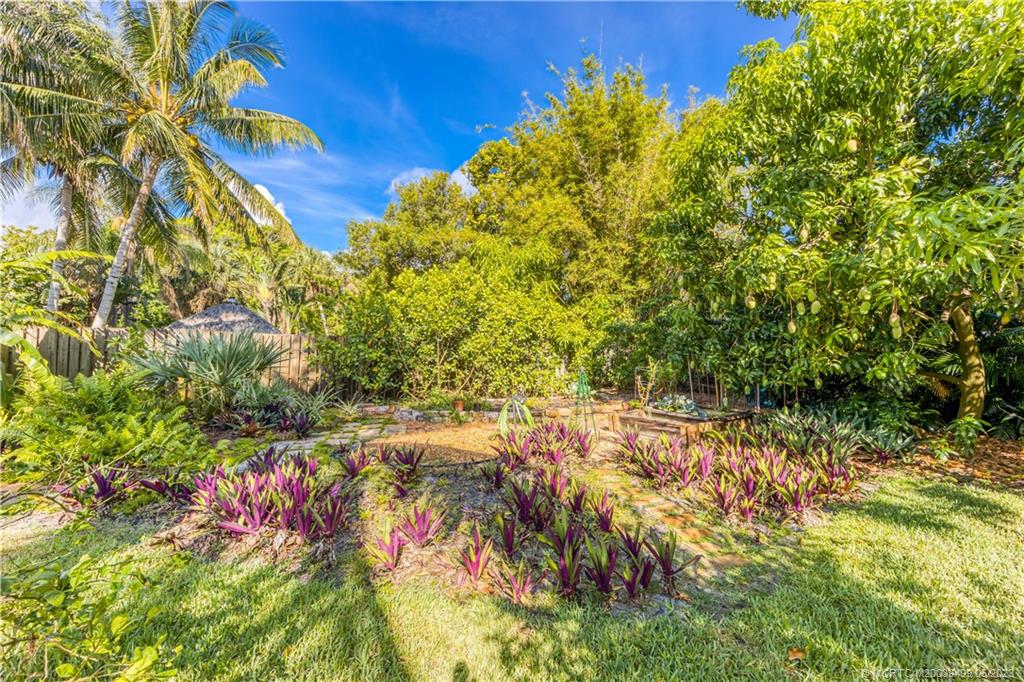 4 Ridgeview Road North Stuart, FL 34996 - Photo 54 of 57 a view of a yard with plants and wooden fence