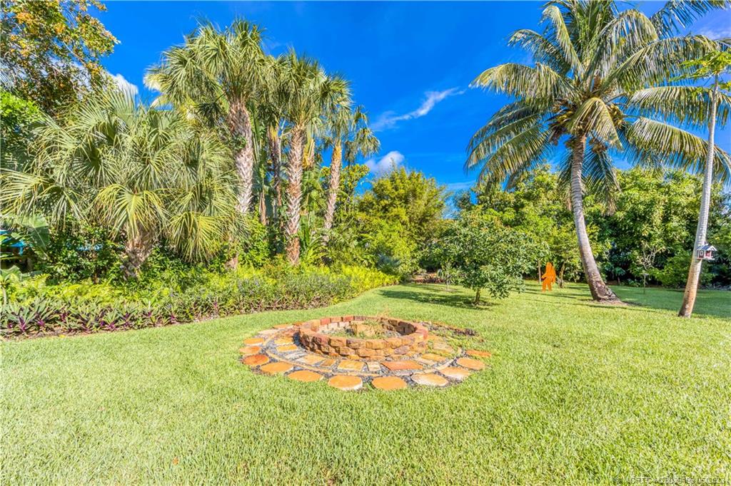 4 Ridgeview Road North Stuart, FL 34996 - Photo 56 of 57 a view of a garden with a tree