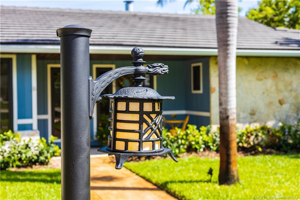 4 Ridgeview Road North Stuart, FL 34996 - Photo 10 of 57 a front view of a house with garden