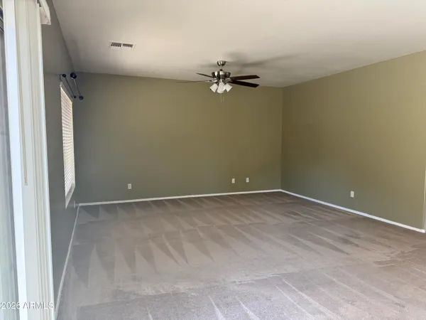 an empty room with a empty space and a window