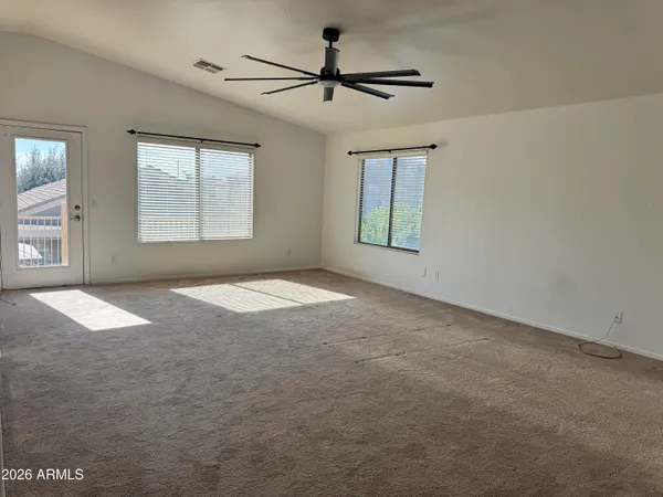 a view of empty room with windows