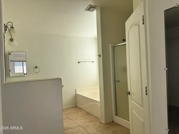 a bathroom with a bathtub and toilet