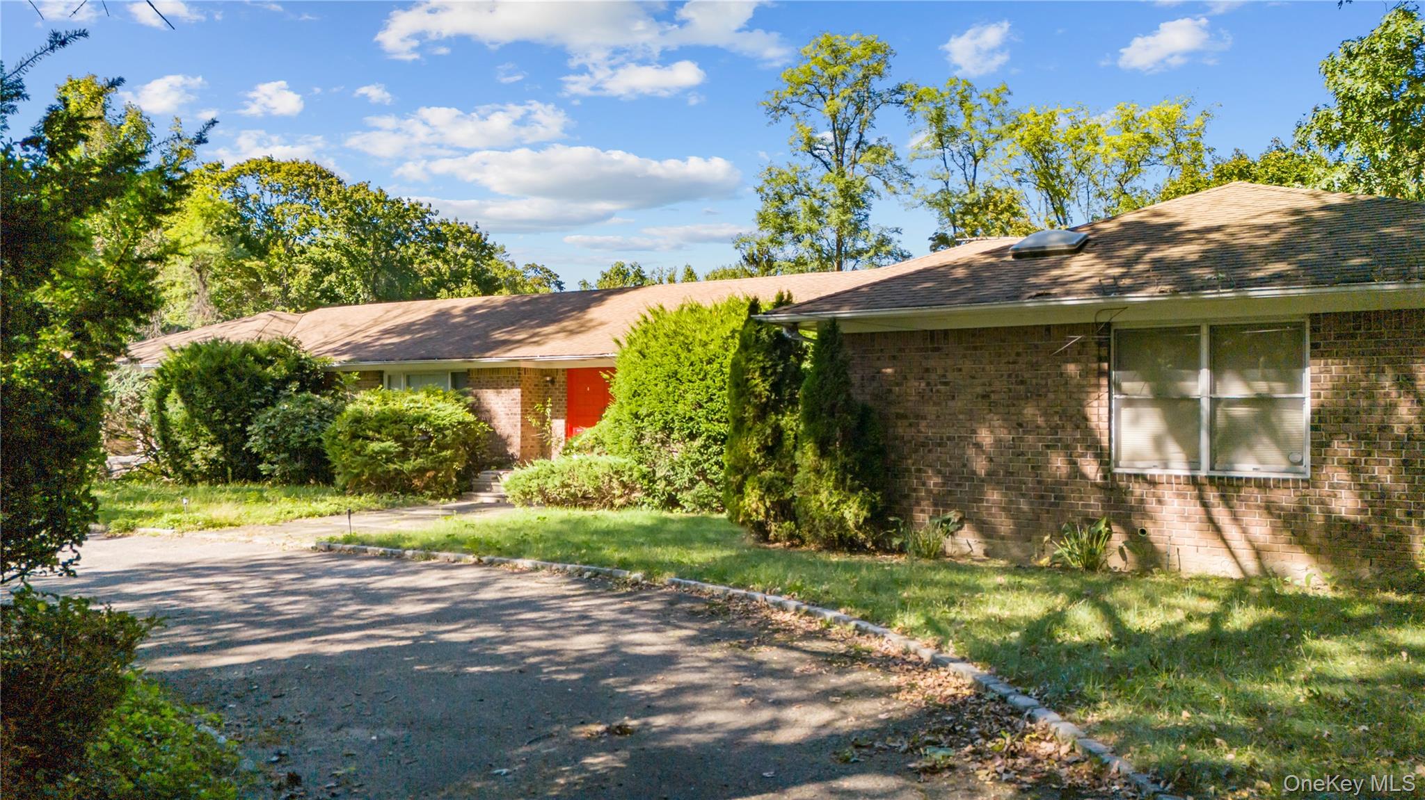 169 Middle Neck Road Sands Point, NY 11050 - Photo 7 of 15 a view of a wooden house with a yard