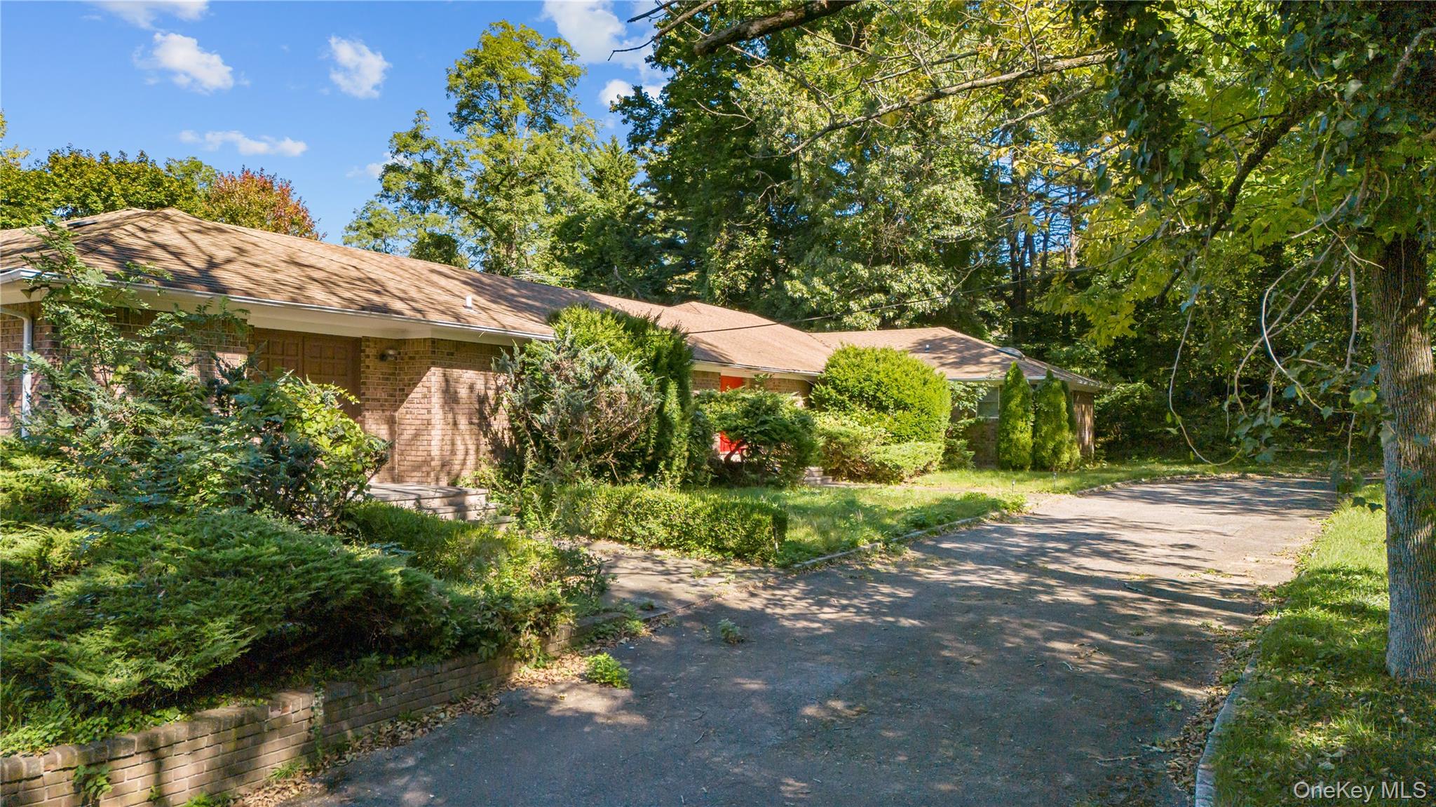169 Middle Neck Road Sands Point, NY 11050 - Photo 8 of 15 a backyard of a house with lots of green space