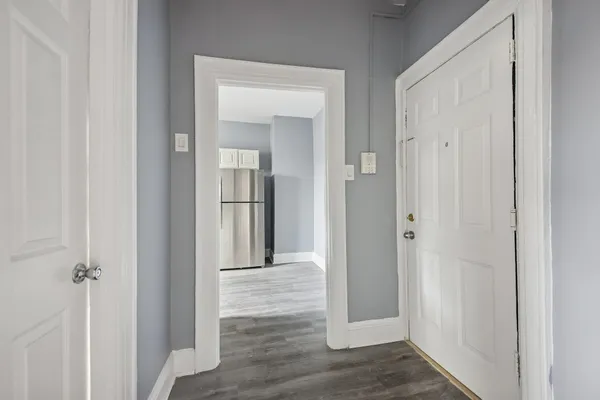 a view of a bathroom from a hallway