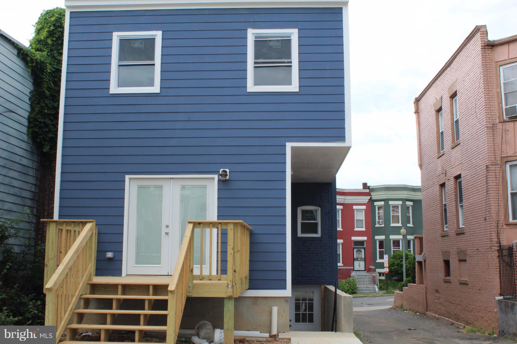 649 Columbia Road Northwest Washington, DC 20001 - Photo 3 of 20 Rear view of deck and parking