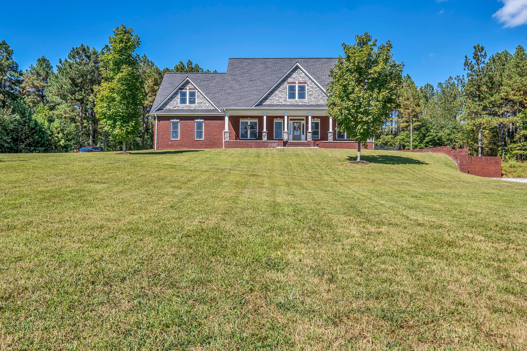 a front view of a house with a yard
