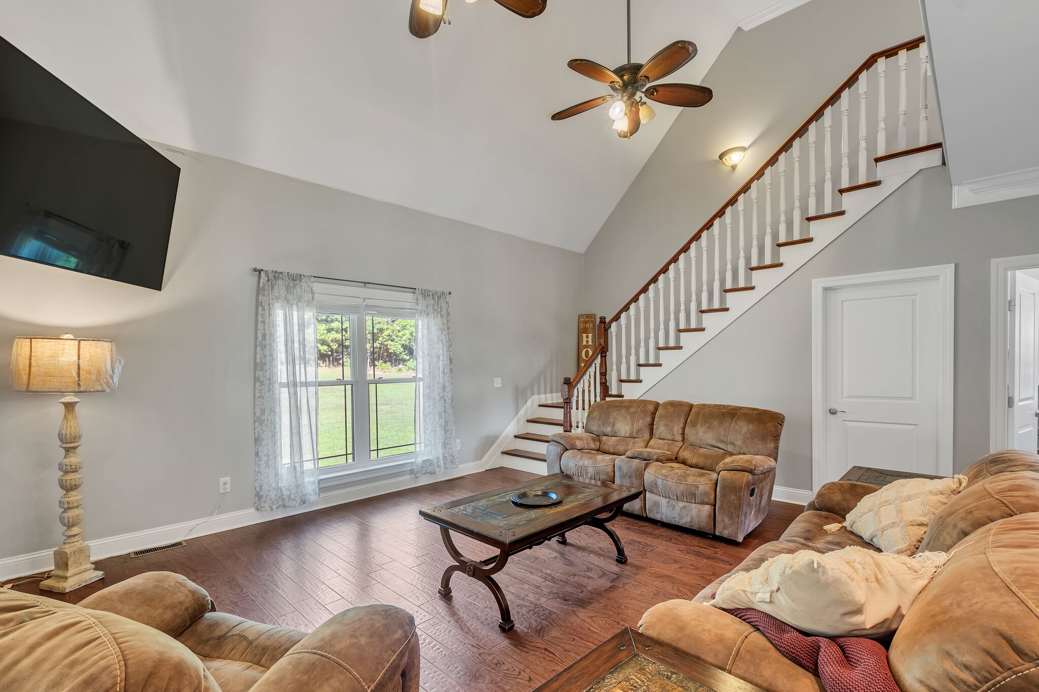 244 Double Eagle Drive Summertown, TN 38483 - Photo 12 of 55 a living room with furniture ceiling fan and a rug