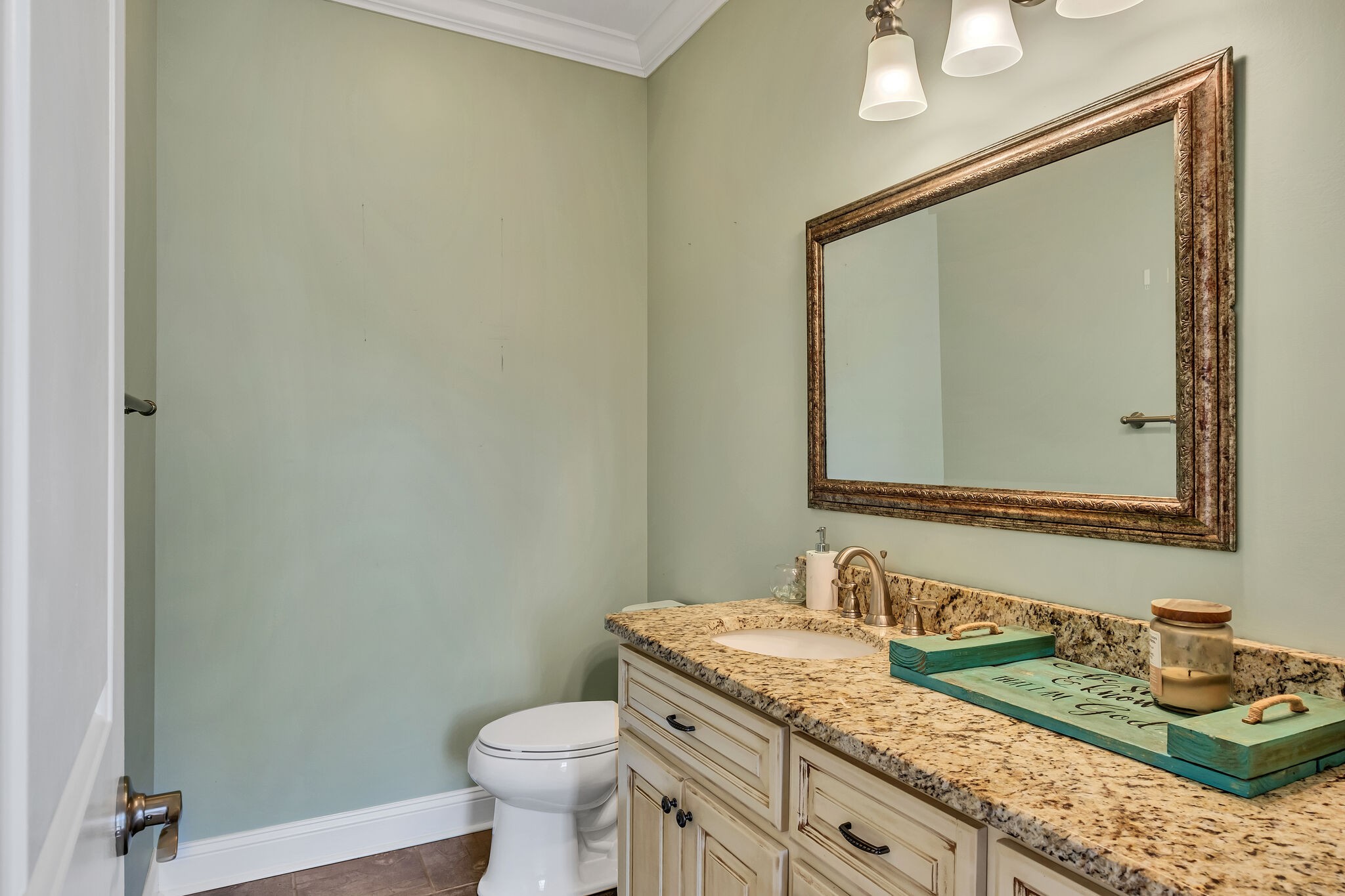 244 Double Eagle Drive Summertown, TN 38483 - Photo 15 of 55 a bathroom with a granite countertop sink a toilet and a mirror