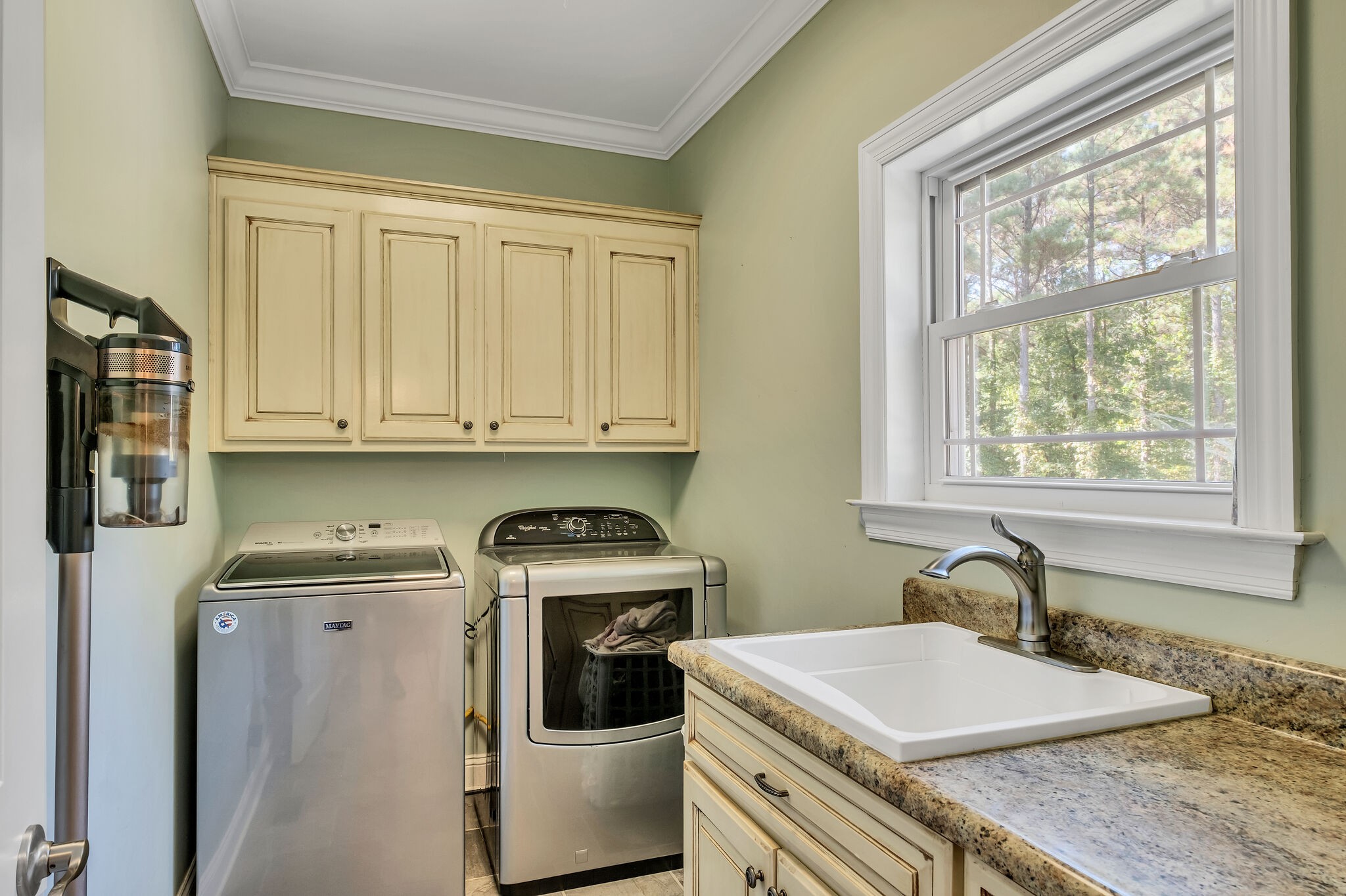 244 Double Eagle Drive Summertown, TN 38483 - Photo 19 of 55 a room with a sink a washer and dryer