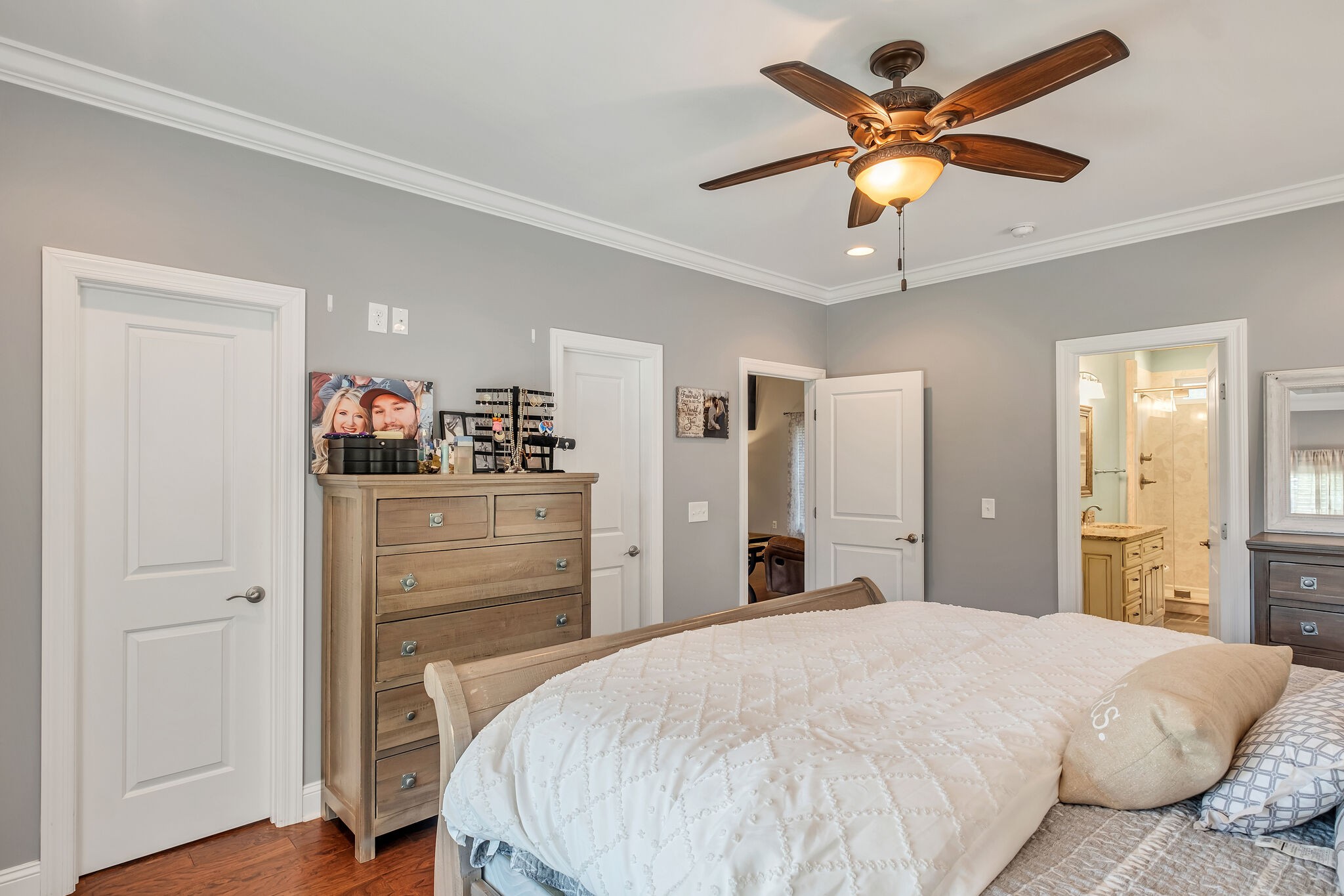 244 Double Eagle Drive Summertown, TN 38483 - Photo 23 of 55 a bedroom with a bed and a chandelier