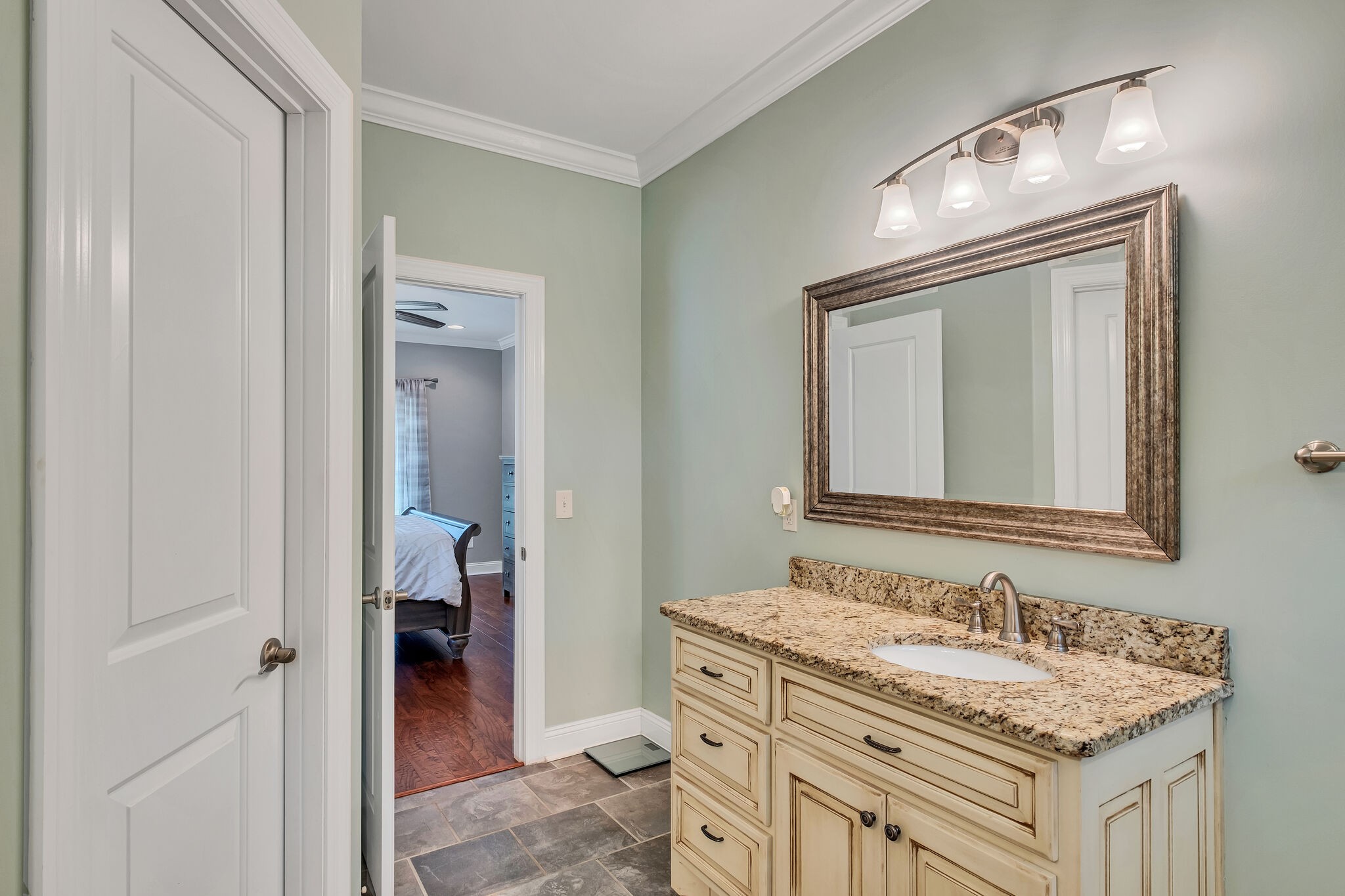 244 Double Eagle Drive Summertown, TN 38483 - Photo 24 of 55 a en suite bathroom with a granite countertop sink and a mirror