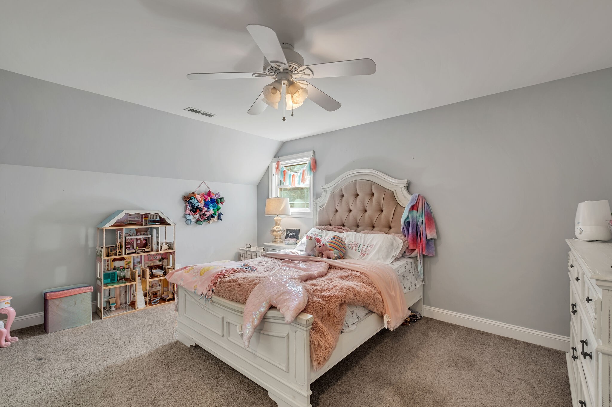 244 Double Eagle Drive Summertown, TN 38483 - Photo 34 of 55 a bedroom with a bed and a chandelier