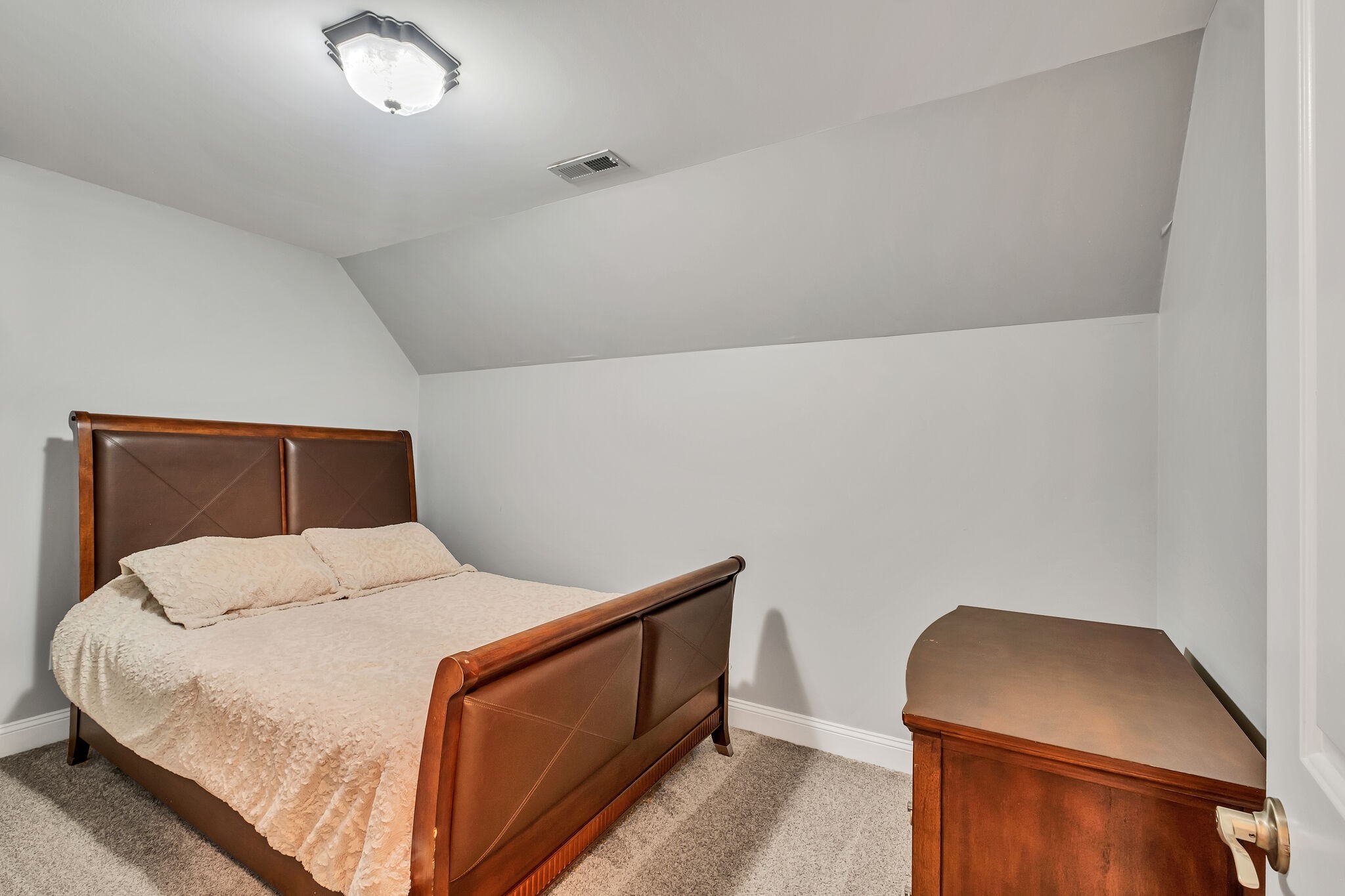 244 Double Eagle Drive Summertown, TN 38483 - Photo 35 of 55 a bedroom with a bed and a dresser