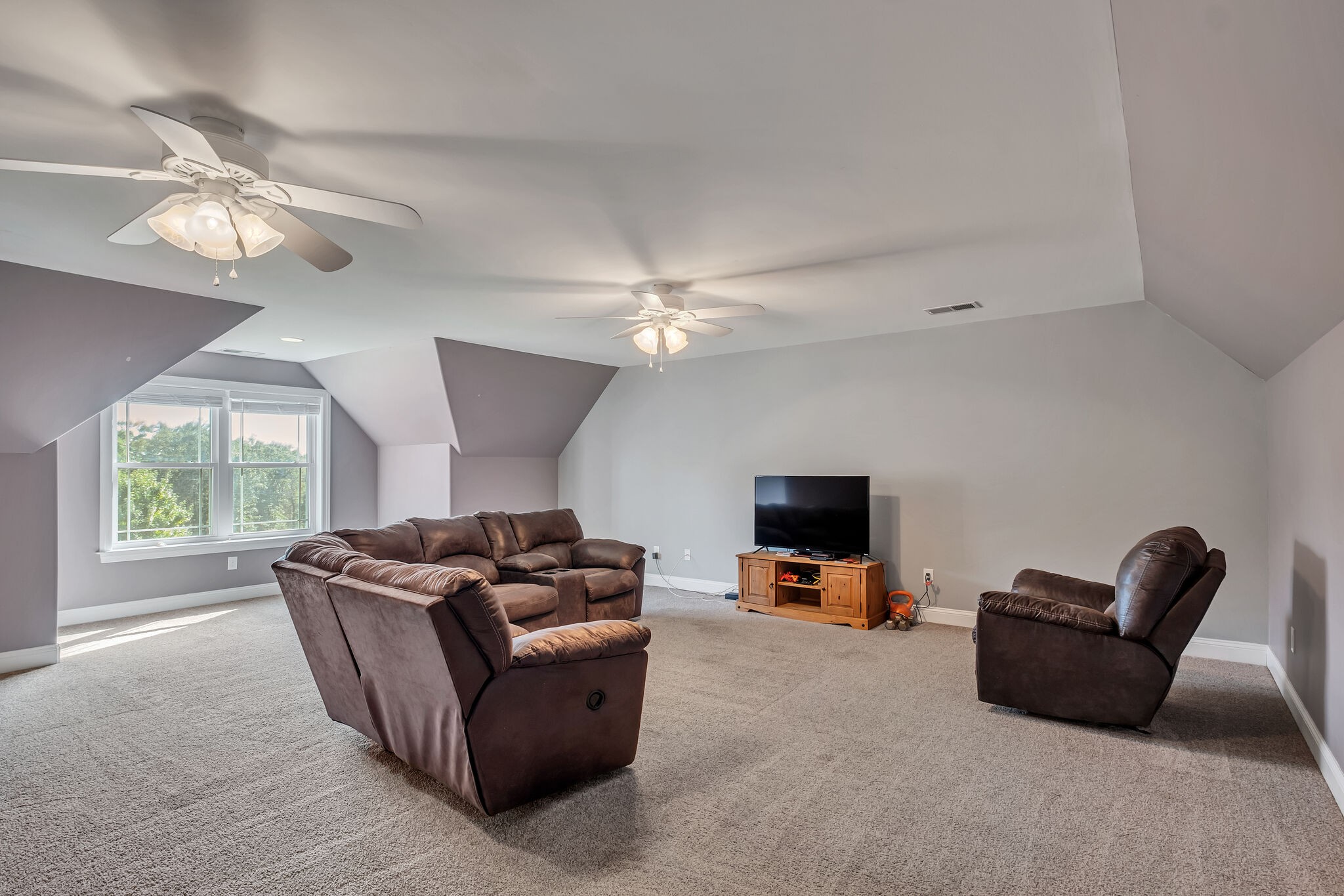 244 Double Eagle Drive Summertown, TN 38483 - Photo 36 of 55 a living room with furniture and a flat screen tv