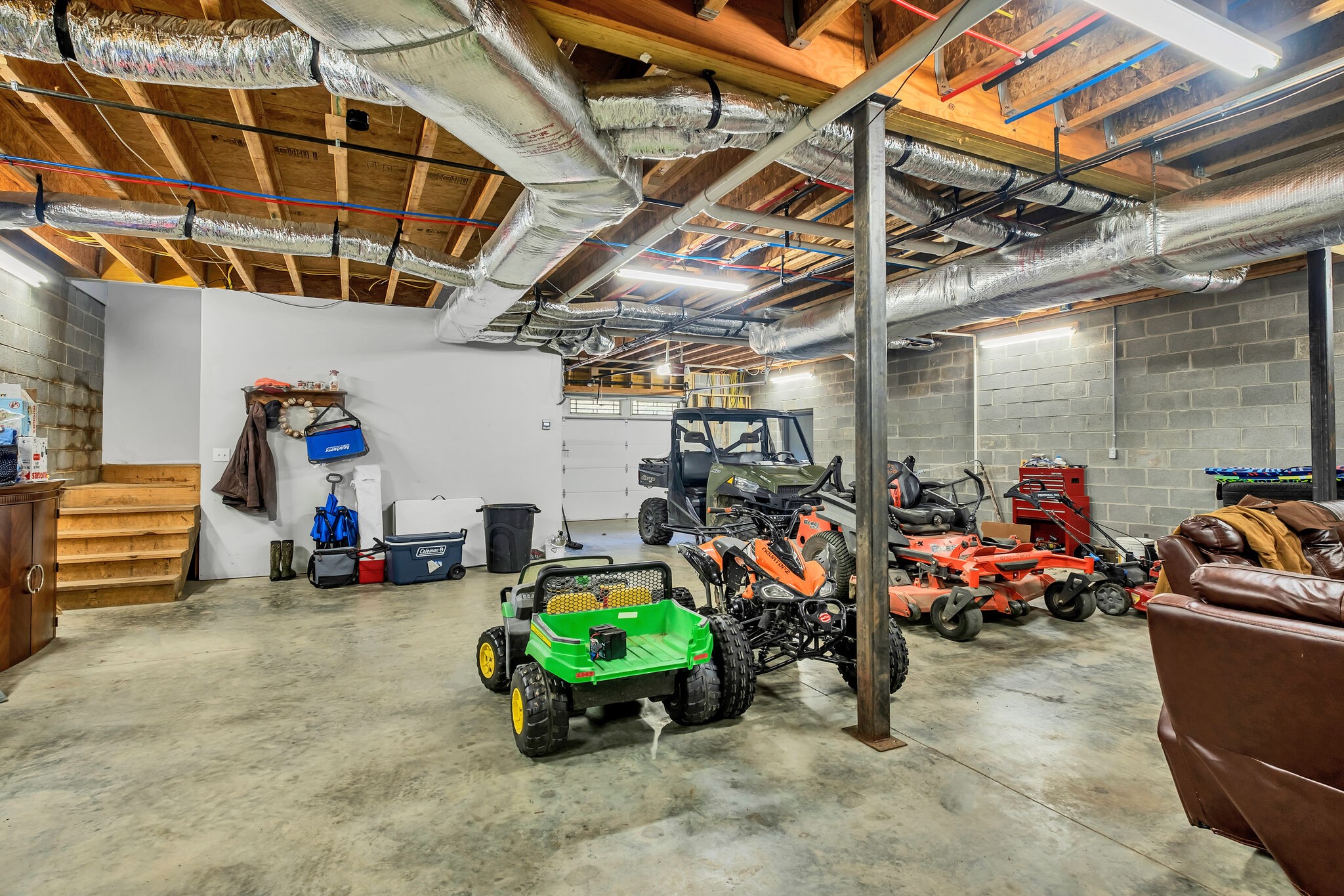 244 Double Eagle Drive Summertown, TN 38483 - Photo 40 of 55 a view of a garage with a bike and white table