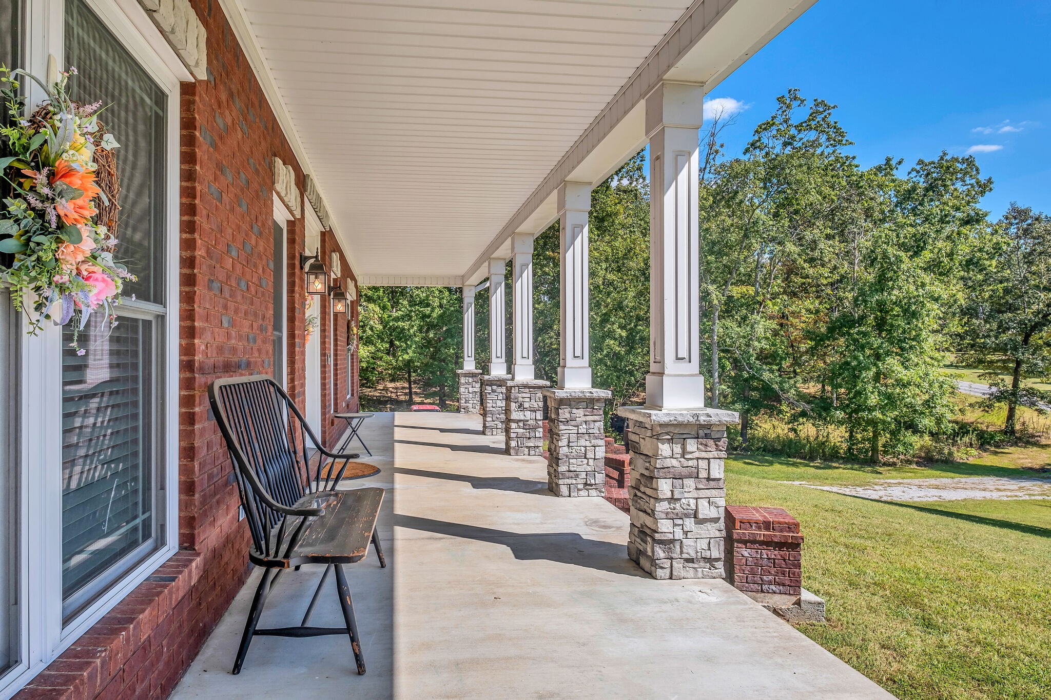 244 Double Eagle Drive Summertown, TN 38483 - Photo 43 of 55 a patio with table and chairs and potted plants