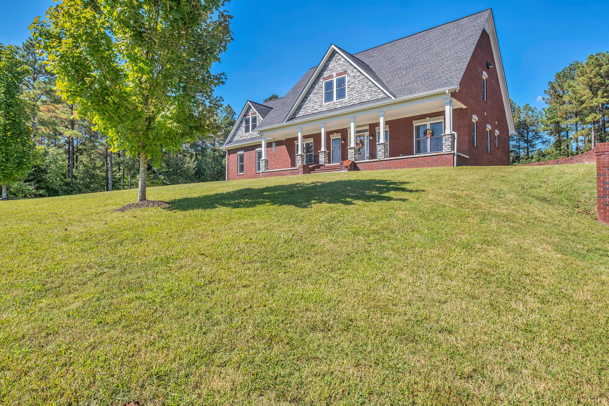 244 Double Eagle Drive Summertown, TN 38483 - Photo 45 of 55 a view of a house with a big yard and large trees