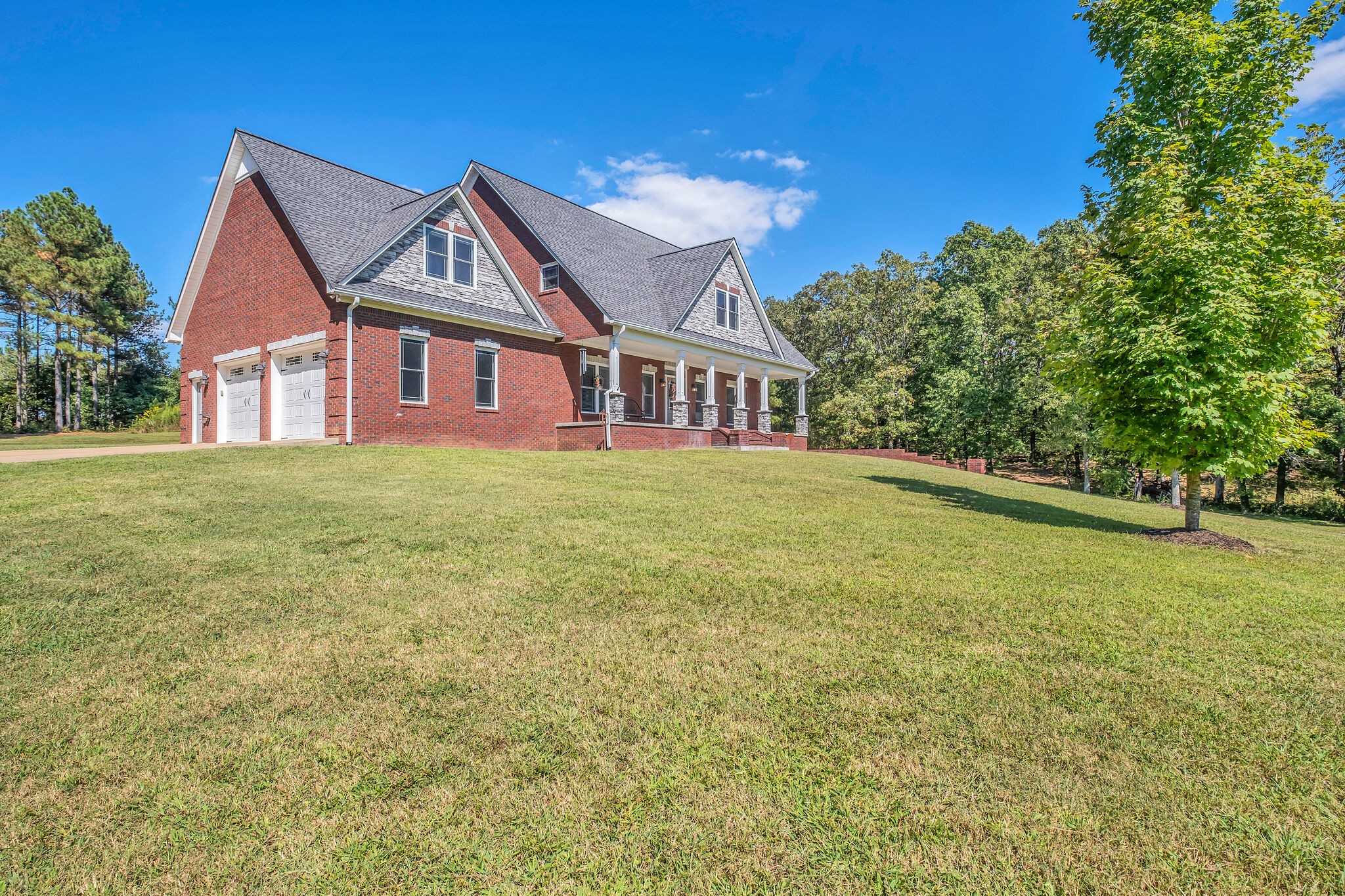 244 Double Eagle Drive Summertown, TN 38483 - Photo 47 of 55 a front view of a house with a garden