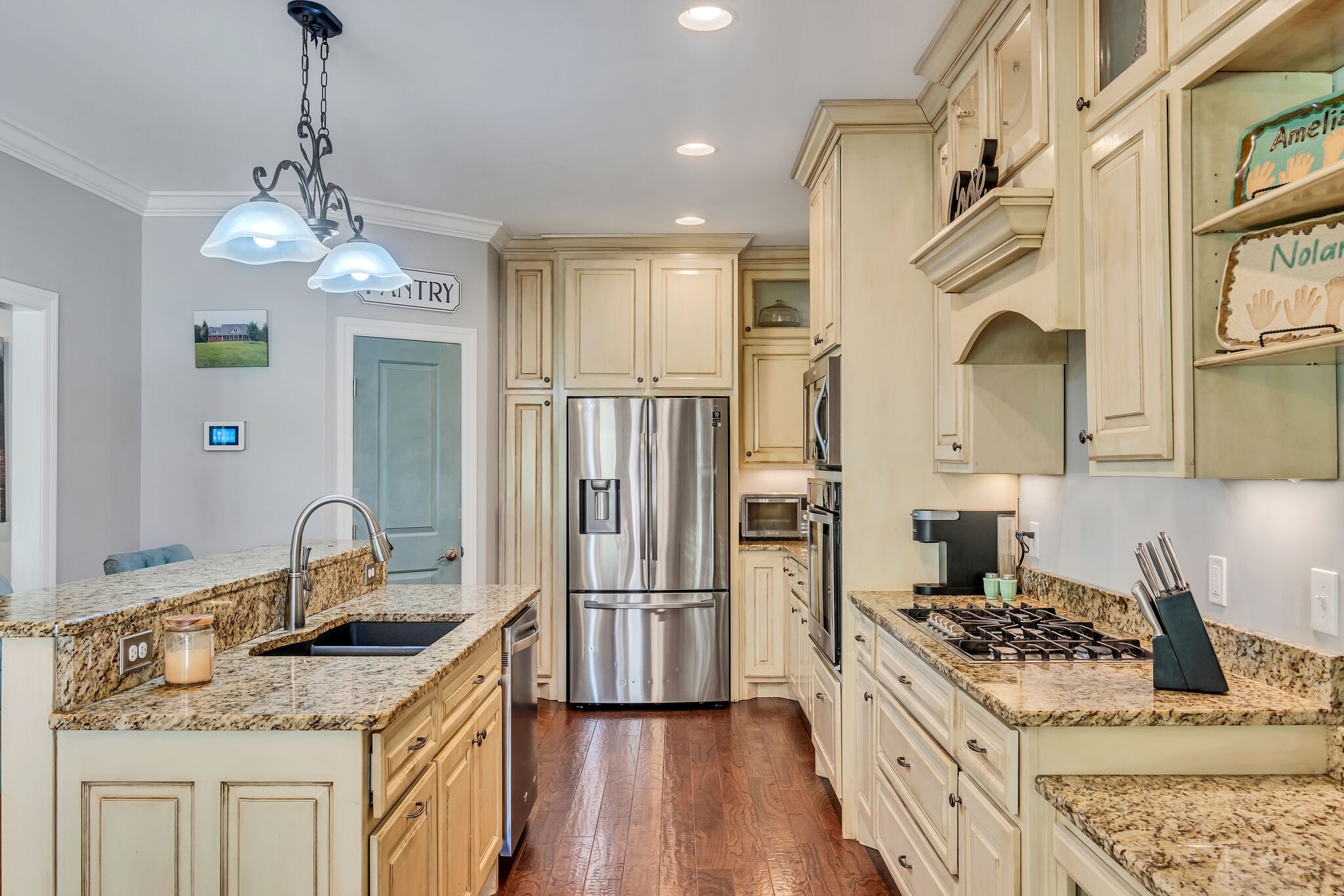 244 Double Eagle Drive Summertown, TN 38483 - Photo 7 of 55 a kitchen with stainless steel appliances granite countertop a sink stove and refrigerator