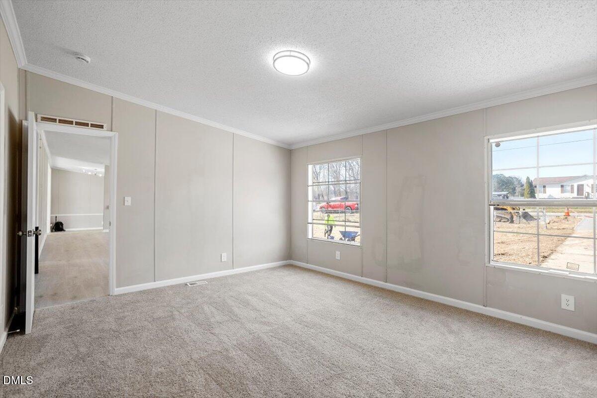 10965 Beaver Dam Road Middlesex, NC 27557 - Photo 16 of 24 a view of an empty room with a window