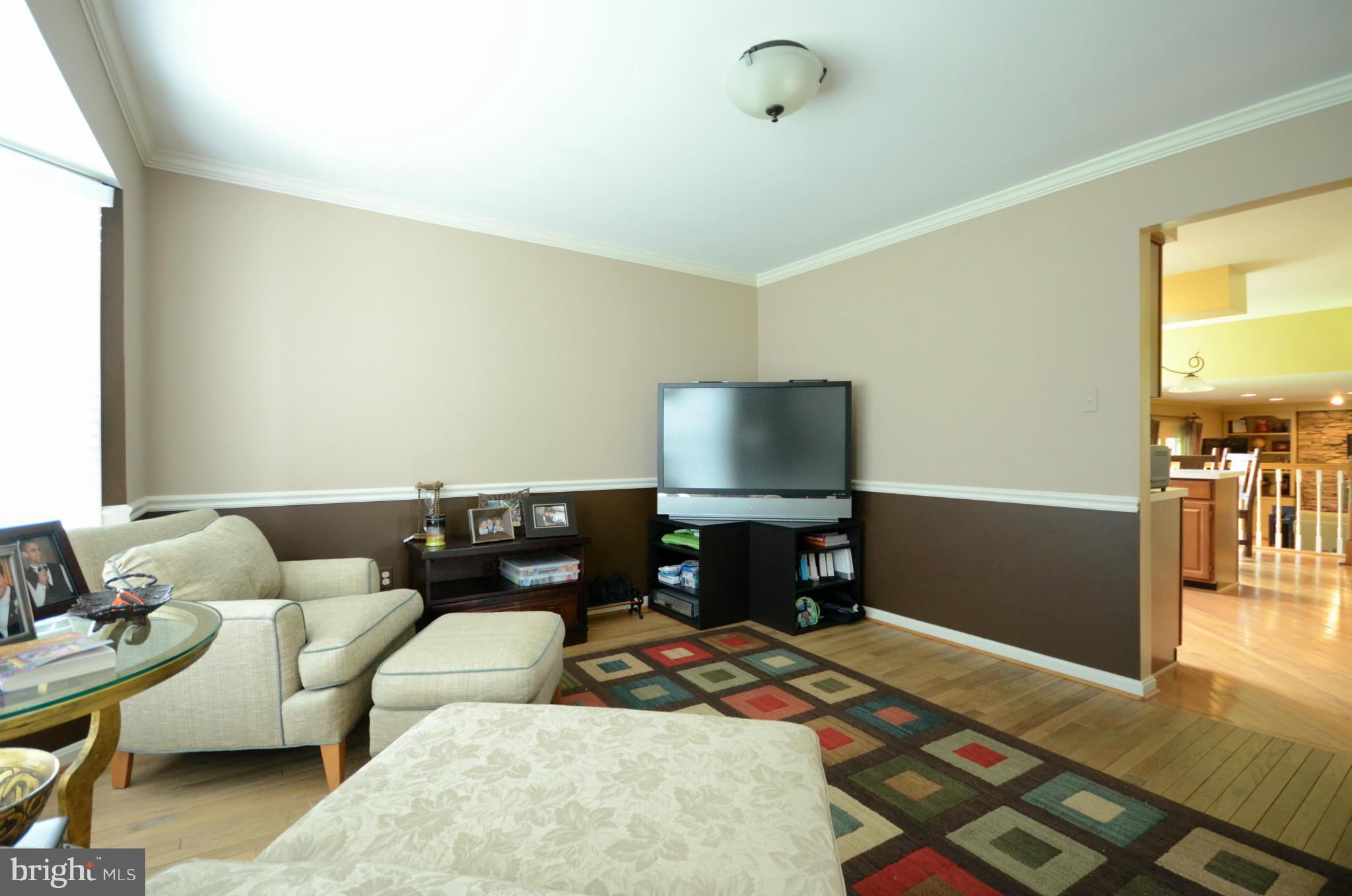 15931 York Road Sparks, MD 21152 - Photo 6 of 30 a living room with furniture and a flat screen tv