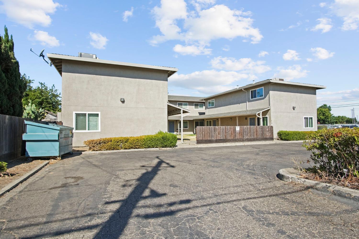 410 Pine Street Ripon, CA 95366 - Photo 3 of 16 a front view of a house with a yard and garage